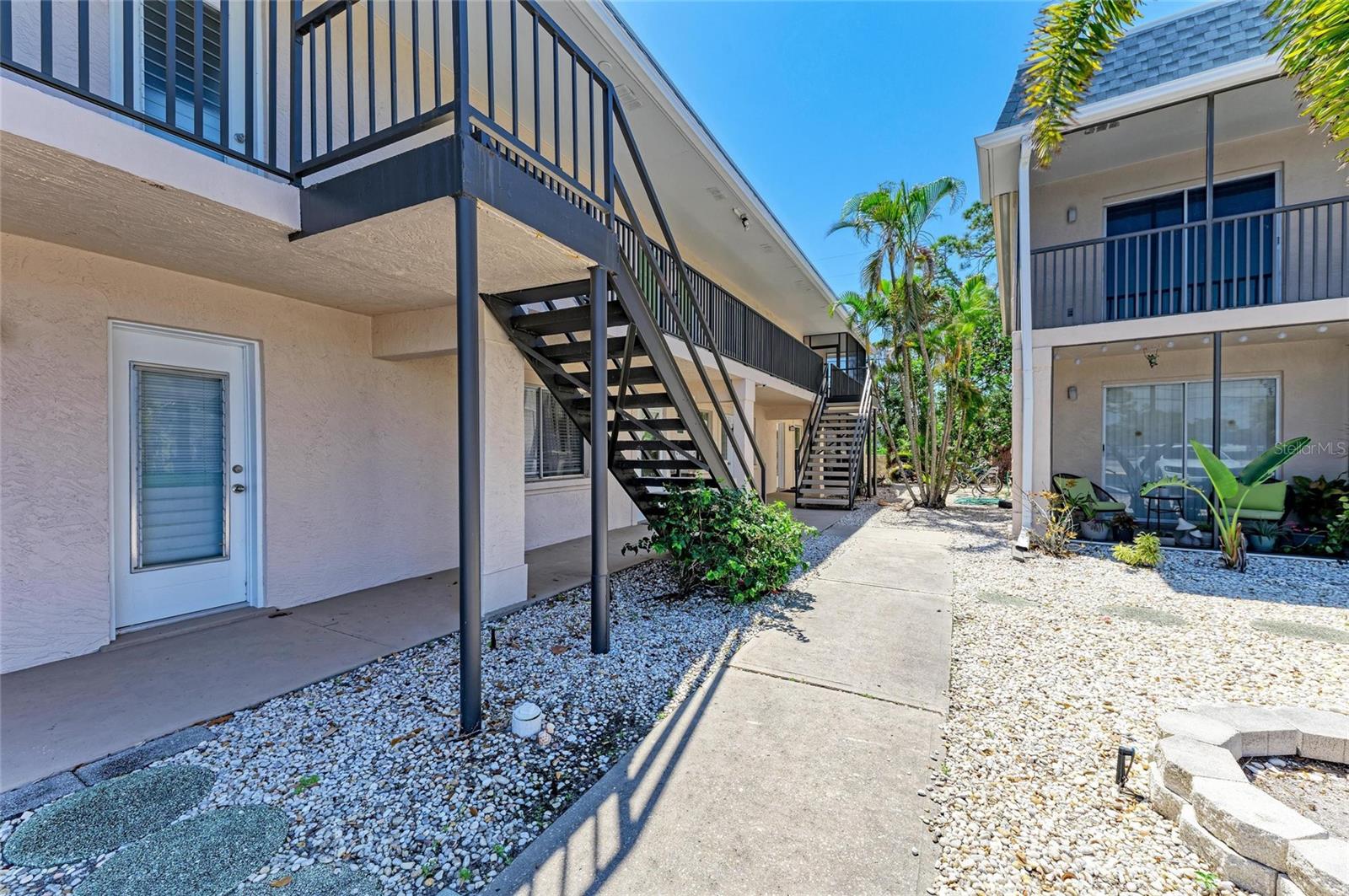 Nestled in the heart of Venice Island, this charming 2-bedroom, 2-bathroom condo offers an inviting blend of recent upgrades and coastal convenience. Stepping inside, you’ll immediately appreciate the open-concept design that seamlessly connects the kitchen, dining, and living areas. Recent renovations, including brand-new vinyl plank flooring and base molding throughout, create a fresh and contemporary feel. A new coat of paint enhances the bright and airy atmosphere, making this space truly move-in ready. The kitchen, updated in 2021, features custom cabinetry, sleek appliances, and recessed lighting that adds a warm and welcoming touch. Flowing effortlessly from the living area, sliding glass doors lead to a spacious screened lanai, providing the perfect spot to relax and enjoy Florida’s year-round sunshine. Whether sipping your morning coffee or unwinding in the evening, this indoor-outdoor connection enhances the home’s appeal. The primary bedroom serves as a peaceful retreat with its en suite bathroom and walk-in shower, while the second bedroom and an additional bathroom provide additional space and comfort for guests or family. Beyond the interior charm, this condo boasts several essential upgrades, including a new AC system, complete plumbing and re-plumbing in 2021, and freshly updated flooring and paint in 2025. Location is everything, and this condo delivers unparalleled access to the best of Venice. The renowned Venice Beach is just five minutes away, while the historic downtown area, with its quaint shops and restaurants, is equally close. Caspersen Beach and Nokomis Beach are both within a short 10-minute drive, providing endless opportunities for relaxation and recreation. With its modern updates and prime location, this condo is truly a gem on Venice Island, offering the perfect blend of comfort and coastal charm.
