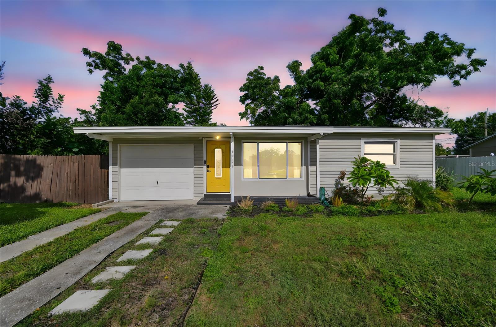 Welcome to this beautifully updated 2-bedroom, 1-bathroom home in the heart of North St. Petersburg—perfectly positioned across from a serene pond that offers tranquil views right from your front door. Step inside to discover a light-filled open floor plan featuring stylish modern laminate flooring and sleek stainless steel appliances. The spacious living and dining areas flow seamlessly, making it ideal for entertaining or relaxed everyday living. This home has remained completely dry and damage-free during past hurricanes, offering both comfort and peace of mind. The large backyard provides endless potential—whether you envision a lush garden, cozy firepit area, or space for pets and play. Located just minutes from vibrant Downtown St. Pete, world-class dining, waterfront parks, and the award-winning Gulf beaches, this home combines convenience with quiet neighborhood charm. With easy access to both Tampa International and St. Pete–Clearwater airports, this is Florida living at its best. Don’t miss the opportunity to own this move-in-ready gem with modern updates, a peaceful pond view, and an unbeatable location.