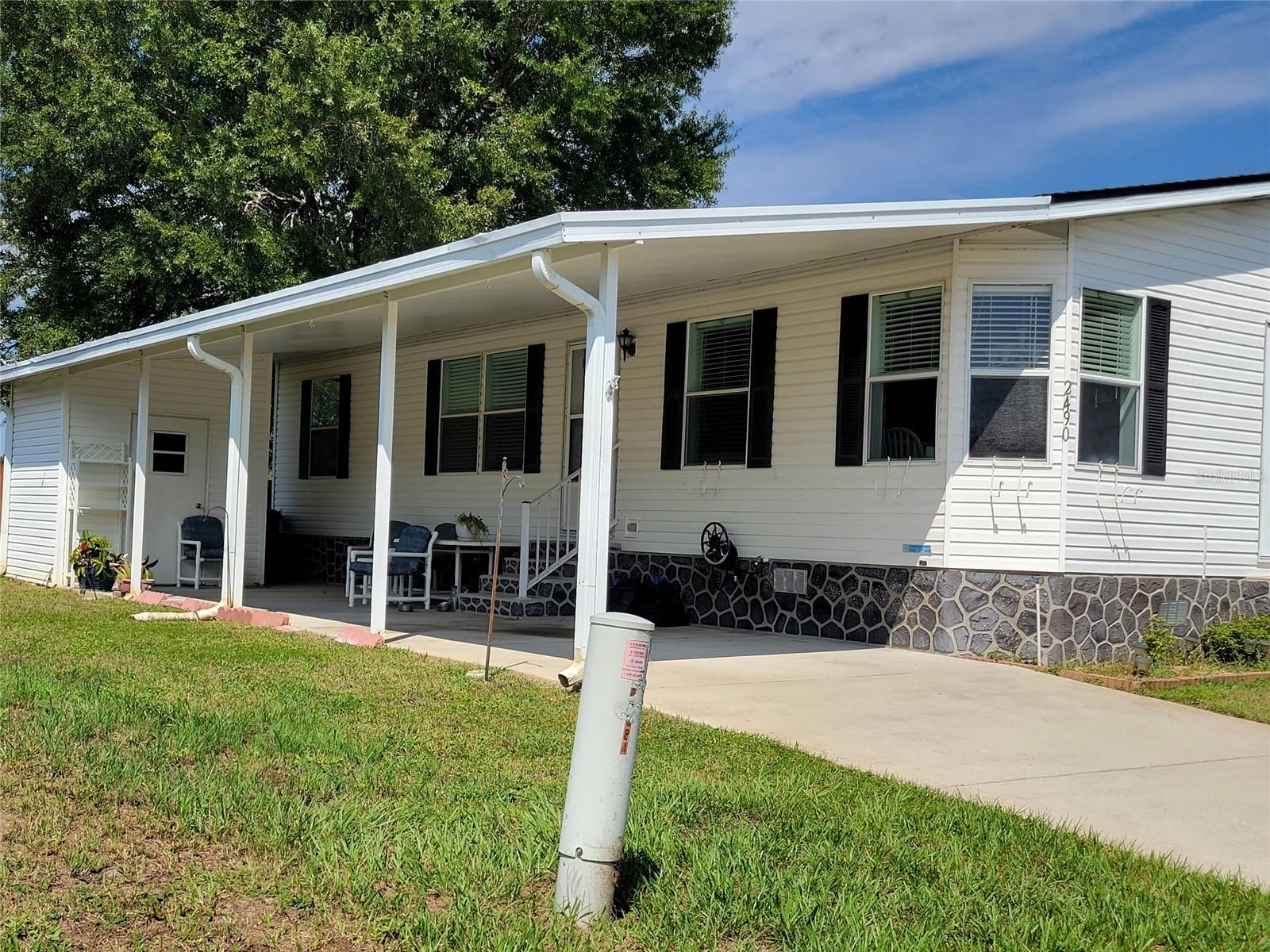 Welcome to this charming 3 bedroom, 2 bathroom double wide manufactured home that perfectly blends modern comfort with classic elegance. Located in St. Cloud, Florida, this home offers both style and functionality designed to meet your every need.
Key Features:
• Spacious three bedrooms and two full bathrooms, providing ample space for family living or hosting guests.
• A stylish kitchen with ample cabinet space invites culinary creativity.
• An owner's suite featuring a single sink vanity, separate tub, and a tranquil shower area for your personal retreat.
• A cozy living and dining area, perfect for entertaining friends or enjoying quiet family meals.
Teka Village is one of the most inviting 55+ communities in St. Cloud. Residents can enjoy an oasis of relaxation and an active lifestyle. The community offers features such as: an active clubhouse with a full calendar of social activities, fostering community spirit and connectivity, a heated indoor pool and fitness center to help maintain an active lifestyle year-round, Gated entry, ensuring peace of mind with increased security and tranquil, quiet streets, reasonably low HOA fees, creating a balanced, affordable cost of living.
St. Cloud is a remarkable place for those who appreciate both the charm of a small town and the conveniences of a bustling city nearby. The home offers easy access to the Florida Turnpike, connecting you to Central Florida’s top attractions, Downtown Orlando, and the world-renowned Lake Nona Medical City and close proximity to the Orlando International Airport to simplify your travel plans.
This property offers more than a house—it's a lifestyle choice in a welcoming community. Whether you prefer relaxing in your cozy home, exploring the vibrant local culture, or engaging with neighbors over community events, this home provides the perfect backdrop.
Interested in making this beautiful property your next home? Reach out for a private showing today and explore how this dwelling can become yours!