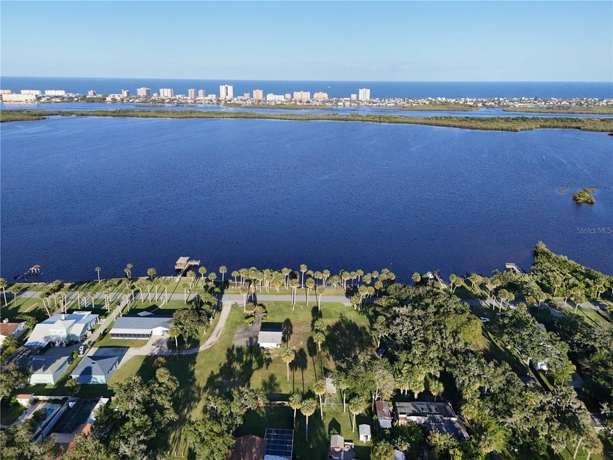 Discover a rare opportunity to own nearly half an acre of waterfront land in Port Orange, Florida. Enjoy wide river views and refreshing breezes along the Halifax River, with convenient access to the ocean, waterfront dining, and Disappearing Island. Plus, you’re just minutes from some of Florida’s most beautiful beaches. Situated along scenic Riverside Drive, this property offers a blend of tranquil waterfront living and proximity to local conveniences, including parks, recreational activities, golf, and shopping.

Bring your preferred builder and create the coastal retreat you have envisioned—without HOA restrictions. Unlock added value with the potential to create two 50-foot buildable lots, supported by a clearly defined process reviewed with local Planning staff. The owners have construction documents on file that were previously prepared for this lot.

The property previously had a residence, so utilities are already in place for connection. A spacious two-and-a-half-car garage remains on the property, offering flexible use for storage, a workshop, or future expansion.