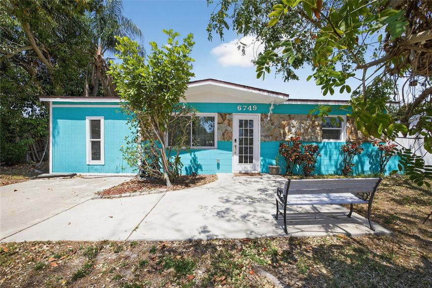 Welcome to your new Pool Home!!  You're going to love this bright and cheerful home located in a wonderful neighborhood. This home features an open living room/kitchen plan with luxury vinyl plank, granite counters and an island ideal for dining. Bedrooms are a split floor plan. Master bedroom is very large and has a spacious walk in closet. House has fresh new paint and bedrooms have new flooring. Bathroom is fully updated. There is also a bonus room off the kitchen that can be used for additional bedroom, office space, or perhaps a dining room. Exterior was newly painted a year ago. White vinyl fence is new too! NO HOA AND NO FLOOD ZONE. Centrally located short distance to groceries, restaurants, and public transit. 25 minutes to Tampa airport. 15 minutes to the beach. Nothing to do but move in and enjoy.