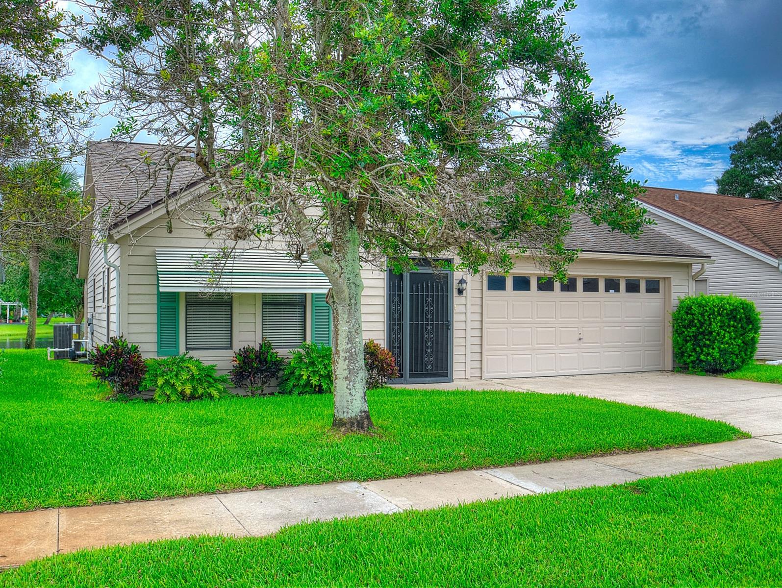 Come home to the best backyard lake view on Pine Island. Remarkable price for a lake view home in a neighborhood nestled next to a canal. Beautiful and serene are the community lake views in this home. Peaceful and quiet neighborhood with underground power lines. Community pool and Gazebo. Beautiful home with updates featuring open floor plan with modern vinyl plank flooring in common areas. Spacious kitchen with island and updated stainless steel appliances and modern backsplash open to living room. Ceramic tile in bathrooms and carpet in bedrooms. Nice screened in Florida room. Spacious two car garage with washer and dryer included. Yard equipped with well irrigation system. Must see to believe before this is gone. ;Water: City