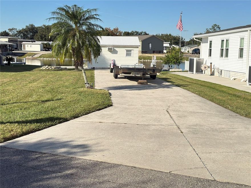 Discover the perfect waterfront retreat with this exceptional Class A motorhome lot in Phase 3 of Mount Olive Shores! This prime location offers breathtaking views of the canal and features a durable concrete slab designed to accommodate any size motorhome with ease. With full public utility hookups, including powerful 50-AMP service, this lot is ready for your next adventure. Plus, there’s ample space to add a manufactured home and an RV port. This lot boasts a fully finished shed equipped with power, offering an ideal solution for storage or the potential for extra living space. Mount Olive Shores is not just a place to park your motorhome; it's a vibrant and secure gated community that fosters lasting connections among its residents. With its prime location just 3.5 miles from I-4, you'll enjoy quick access to an array of shopping outlets, malls, and world-class medical facilities. Both Tampa and Orlando international airports are less than an hour away, putting the best of central Florida at your fingertips.

Important to note: this is a deed-restricted community specifically for Class A motorhomes, so you’ll need to own or lease a Class A motorhome your first year of residency. Seize this opportunity to become part of a welcoming community while enjoying the ultimate Florida lifestyle!