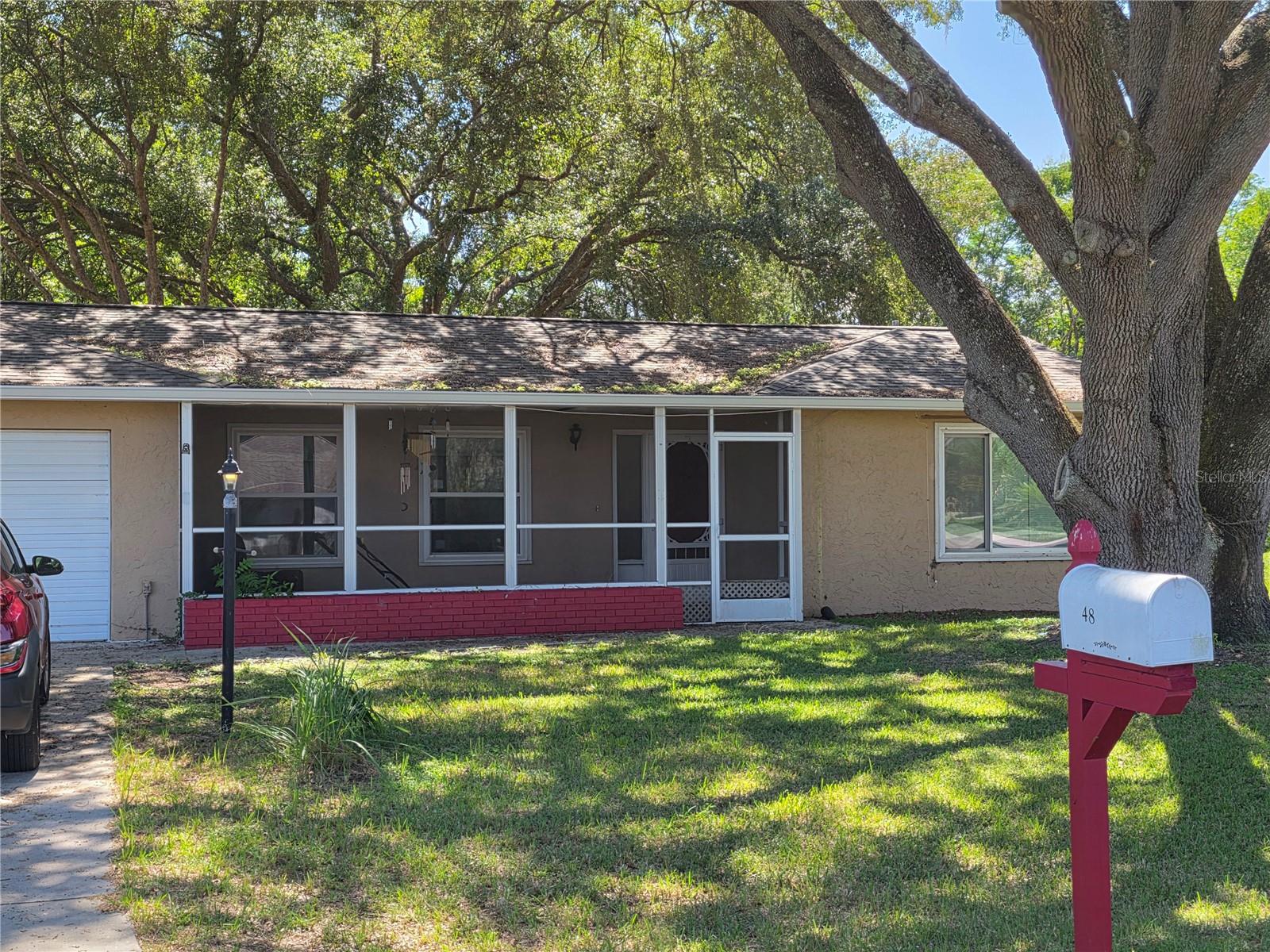 This charming home is nestled among mature oaks on an over-sized lot with a private fenced-in backyard. You will find a front screened-in lanai measuring 22' x 5' and a back screened-in lanai measuring 20' x 8'. Updates: NEW GUTTERS & LIFETIME WARRANTY Leaf Guard System 2025 - NEW ROOF 2024 - NEW HVAC 2022 - NEW FRONT WINDOWS 2021 - Stainless Steel REFRIGERATOR 2022 - NEW Stainless Steel DISHWASHER 2025 - NEW GARBAGE DISPOSAL 2024 - Interior Painted in 2024. Water Heater installed approximately 2016. The GARAGE is under Heat & Air as well. Only minutes from Ocala, The Villages and Lake Weir; shopping, grocery and restaurants close.