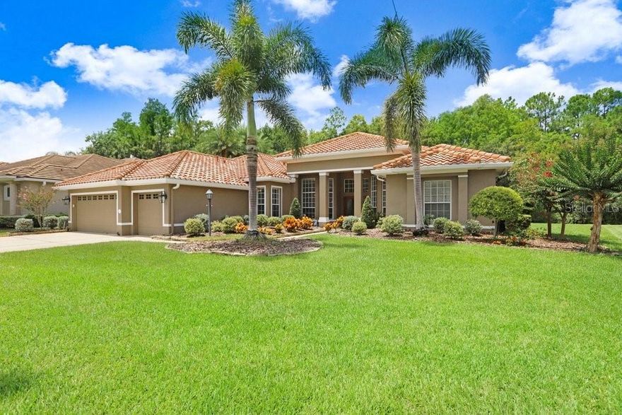 Exquisite Custom Estate with Conservation, Pond & Golf Course Views in the heart of Gated Harbor Links in Westchase - ideal for multi-generational living. For the discerning buyer seeking timeless elegance and modern sophistication, this stunning Costanza-built custom estate is a true masterpiece. Perfectly situated on a premium conservation homesite with serene pond and golf course views, this 3-bedroom, 3.5-bathroom, office home offers impeccable craftsmanship, luxurious finishes, and exceptional attention to detail. Please note bedrooms 2 and 3 were combined to create a second master suite and could be converted back to create a 4th bedroom. As you step through the grand entryway, you're immediately greeted by abundant natural light, gleaming hardwood floors, and soaring ceilings adorned with crown molding. Architectural highlights include mitered picture windows, a dramatic octagonal vaulted ceiling, and upgraded French doors that seamlessly connect indoor and outdoor living spaces. At the heart of the home lies the chef’s dream kitchen, featuring custom 42” hardwood cabinetry, granite countertops, premium Wolf & Sub-Zero appliances, a striking copper vent hood, and a 90-bottle wine refrigerator. The expansive breakfast bar, walk-in pantry with wood shelving, and cozy dinette overlooking the lanai complete this culinary haven. The spacious family room is perfect for entertaining, offering a gas fireplace, generous seating space, and direct access to the screened-in lanai and pool area. The luxurious owner’s retreat is a true sanctuary, boasting volume ceilings, custom closet systems, private pool access, and a peaceful sitting or work area. The opulent ensuite bathroom pampers with a sunken garden tub, dual-head walk-in shower, dual vanities, granite counters, and elegant travertine tile flooring. Ideal for multigenerational living, the secondary suite is oversized and features a walk-in closet, rich marble-tiled ensuite bath, and a spacious walk-in shower. The third bedroom, equally charming, offers hardwood floors and a private bath with a tub/shower combination. Enjoy year-round outdoor living in the screened brick-paved lanai, complete with heated pool & spa, expansive sunbathing deck, and generous covered patio space—all set against the backdrop of lush conservation and panoramic views. Additional features include a dedicated office, powder room, and an oversized 3-car garage with built-in cabinetry and a water softener system. This is more than a home—it’s a lifestyle. A rare opportunity to own a one-of-a-kind residence where luxury meets nature in perfect harmony. Westchase offers many shops, restaurants, parks, and recreational options. Zoned for top-rated schools and conveniently located near Tampa International Airport, downtown, and the beaches. Roof (2018), HVAC #1 (2024), HVAC #2 (2009/2010), Hotwater Tank (2021).