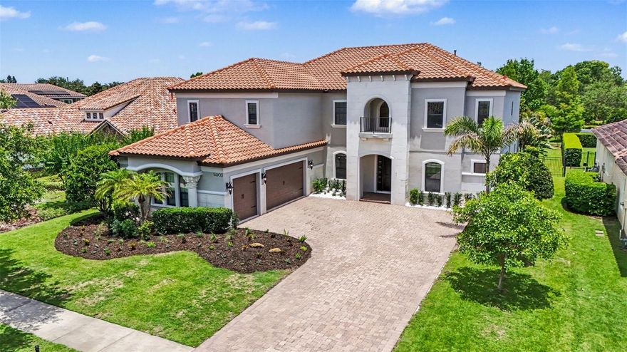 An exceptional opportunity awaits in Old Memorial Estates, a premier gated enclave known for its privacy, prestige, and beautifully appointed residences. Set on nearly half an acre in one of Tampa’s most sought-after luxury communities, this beautifully maintained residence offers privacy, space, and refined Florida living just minutes from top-rated schools, premier golf, dining, shopping, and Tampa International Airport. Freshly painted inside and out (2026), the home delivers a crisp, move-in-ready feel with thoughtful updates throughout. A 3-car side-load garage enhances the curb appeal, complemented by natural stone accents and lush landscaping, setting the tone for the elegance found within. Inside, you’re greeted by soaring volume ceilings and a light-filled, open layout designed for both everyday comfort and upscale entertaining. The heart of the home features double kitchen islands, creating an exceptional space for gathering, cooking, and hosting with ease. The living areas flow seamlessly to a large covered patio, extending your living space outdoors and embracing true Florida indoor-outdoor living. The primary suite and a secondary suite are conveniently located on the first floor, offering flexibility for guests or multigenerational living. Upstairs, you’ll find four additional bedrooms, a versatile loft retreat, a kitchenette, and a dedicated home theater room, creating an expansive second level perfect for entertainment and relaxation. The backyard is a true blank canvas, ready to accommodate a custom pool and outdoor oasis tailored to your vision. Schedule your private tour today and experience the elegance, accessibility, and lifestyle that make Old Memorial Estates one of Tampa’s premier gated communities.