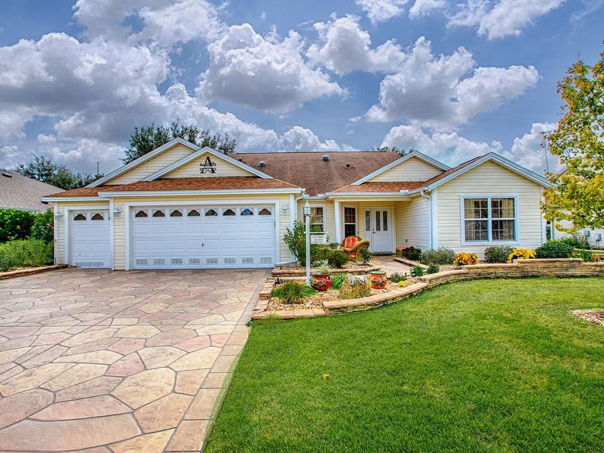 STUNNING & PRIVATE 'PARK-LIKE' SETTING WITH WATER VIEWS LOCATED IN THE VILLAGE OF WOODBURY!  TRULY A RARE FIND!  BOND PAID! ROOF 2019! HVAC 2024!  This 3/2 Designer Home includes a HUGE 28x21 FLORIDA ROOM WITH VIEWS AND A GOLF CART GARAGE!  OPEN & SPLIT FLOOR PLAN, VOLUME CEILINGS, CROWN MOLDING, NEW LUXURY VINYL PLANK FLOORING with TILE in the FLORIDA ROOM. The Spacious Kitchen has White Cabinets w/Crown, SS APPLIANCES, GRANITE COUNTERS and an Inviting Breakfast Bar & Cozy Breakfast Nook! The Dining area is accented by Architectural Columns and the Living Area opens to a LIGHT & BRIGHT FLORIDA ROOM creating additional living space, PERFECT for ENTERTAINING! The Primary EnSuite w/ walk-in closet(s), His & Her Sinks & Tiled Walk-in Shower.  The Two Guest Rooms are located on the opposite side of the home offering privacy (one does not have a closet).  The Guest Bath has a Tub/Shower combo.  The Laundry Room is conveniently located in the hall leading to the garage.  There is plenty of parking and storage in the TWO CAR plus GOLF CART GARAGE.  The Village of Woodbury rests among some tall oaks and the wide-open spaces created by golf courses and a wildlife preserve. The Mulberry Grove Village Recreation Center is close by, and features a fitness club, arts and crafts room and plenty of meeting rooms for clubs and activities. Outside, residents can enjoy the sports pool, bocce, shuffleboard, pickleball, horseshoes or basketball. Woodbury residents can easily access the Nancy Lopez Legacy Country Club, a beautiful location where golfers can enjoy 27 holes of championship golf! You can also choose between two fine executive courses: Walnut Grove or Briarwood. And, the restaurant is fabulous - a great place to gather with friends or family.