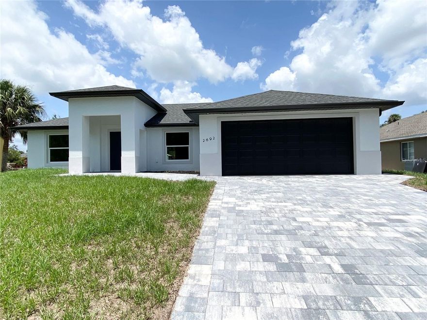 MOVE IN READY!!! Welcome to your dream home in North Port, FL! This stunning new construction boasts a modern and inviting open floor plan, designed for both functionality and luxury living. With 3 spacious bedrooms and 2 elegantly appointed bathrooms, this custom-built residence offers the perfect blend of comfort and style. Step inside and be greeted by the fireplace in the spacious living room, soaring high ceilings that create an airy and expansive atmosphere throughout the home. The heart of this abode is the gourmet kitchen, featuring granite countertops and top-of-the-line stainless steel appliances. Enjoy privacy and peaceful views in this beautiful home backing onto a greenbelt, with no rear neighbors and added sense of space.This house is Conveniently located on a street with new homes around very close to I-75, shopping, dining and many local beaches. Also located in North Port close to several schools and a short car ride away from Centennial Park and Pool as well as a variety of dining and shopping options including Cocoplum Shopping Center. Take advantage of all the area has to include  multiple golf courses and TWO Major League Baseball Spring Training stadiums! Within 15 minutes drive you can be at WELLEN PARK, the new Atlanta Braves Training Stadium, Cool Today Park, and the highly anticipated new Costco store!!! Close to shopping, restaurants, and River. Within 25 minutes drive , you can be at Manasota Beach on the Gulf of Mexico, Aquatic Center, and much more. No HOA/ CDD!!! NO FLOOD INSURANCE REQUIRED! Call now to schedule a showing before this home passes you by!!!