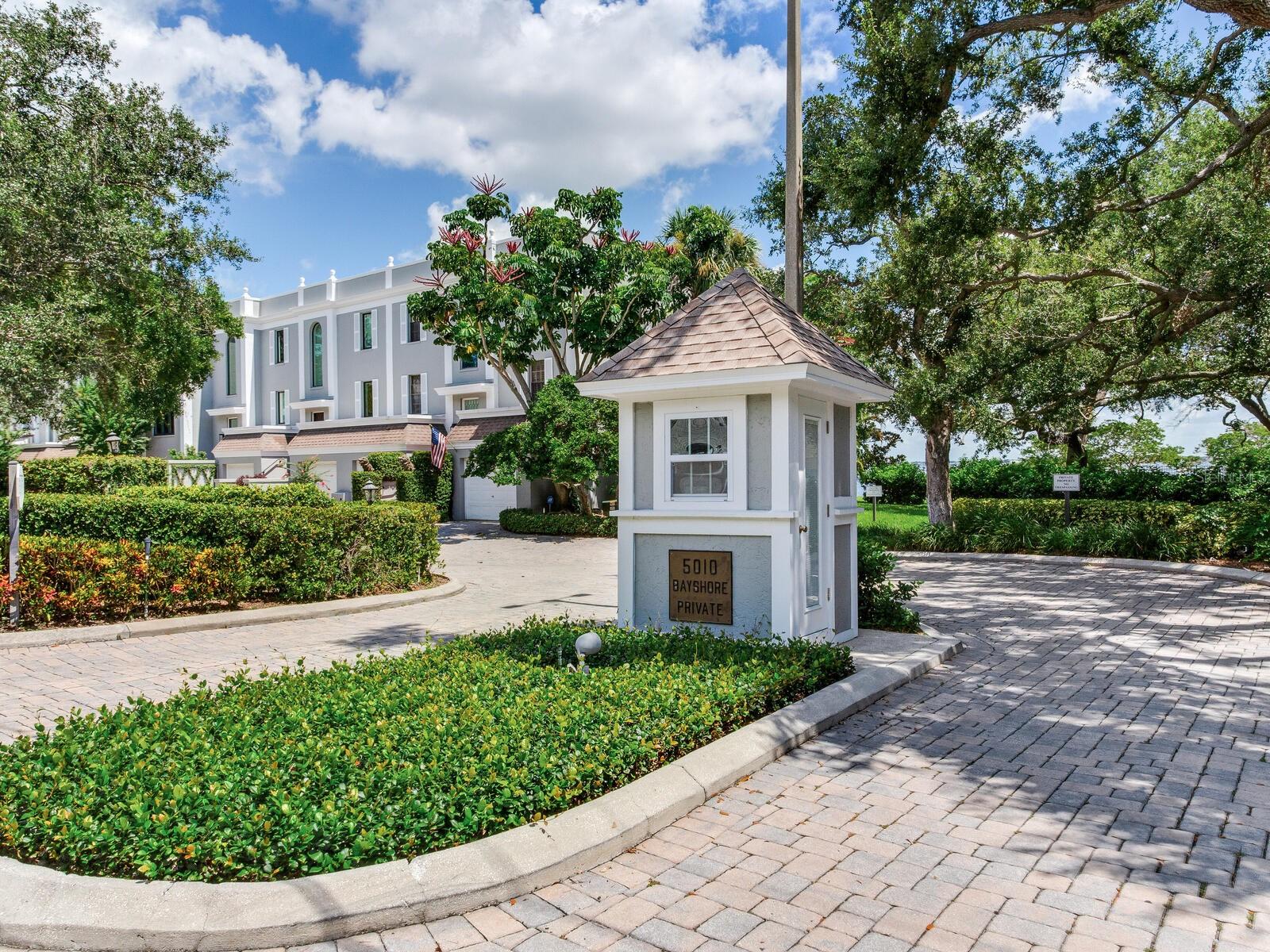 This corner, open-bay and downtown water view villa is truly a gem to see. It offers three or four bedrooms, depending on your desired use, and features a grand living and dining area with views of water, water, water in every direction. The entire unit is light and bright, with an abundance of floor-to-ceiling windows and electric window shades throughout for effortless light control and privacy.
The spacious primary bedroom and bath include a generous walk-in closet, breathtaking water views, and a convenient laundry chute that leads directly to the laundry room below. One of the three bedrooms is currently used as a den, lined with custom cabinetry—part of the cabinet wall could easily be reconfigured to create a built-in closet.
An elevator provides easy access between levels. The ground floor is designed for entertaining, featuring a full bath and flexible space that can serve as an executive-style suite, complete with another bedroom and living area. This level also showcases the same stunning water views and opens to a private patio with grass and a lawn that extends right to the water’s edge.
The laundry room and two garages are also located on this level—both garage floors have been finished with a sleek and durable epoxy coating. The property includes a beautiful waterfront pool and plenty of auxiliary parking for guests.