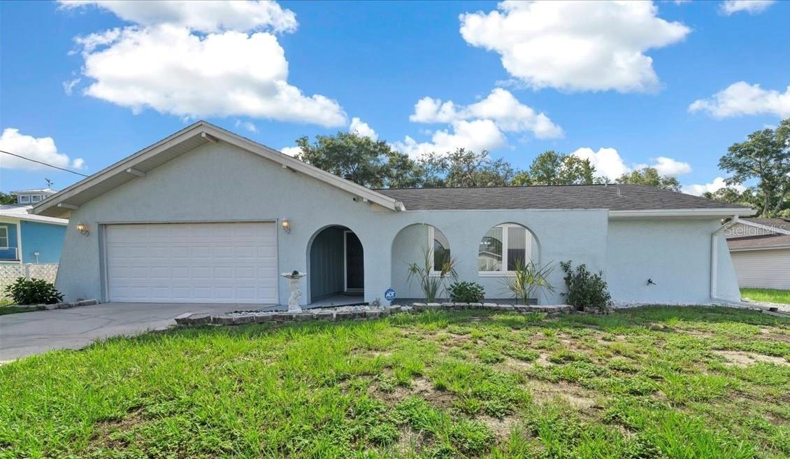 Looking for extra space, privacy and a prime location near the water? This beautiful 3-bedroom, 2-bath home sits on two combined lots totaling 0.60 acres and offers 1,842 sqft of living space and a flexible floor plan to fit your lifestyle. Best of all—this home has never flooded and is located just minutes from Fort Island Gulf Beach and the heart of Crystal River, where you can enjoy fishing, boating, dining and swimming with manatees. Inside, you’ll find tile flooring throughout the main living areas, creating a clean and low-maintenance foundation for everyday living. There’s a welcoming living room near the entry plus a second family room off the kitchen featuring a wood-burning fireplace. The kitchen includes plenty of cabinet and counter space, a pantry and an efficient layout that opens up to the main living areas.Split bedroom layout provides added privacy, with the primary suite tucked away on one side of the home. It features a spacious en-suite bath and a walk-in closet. On the opposite side,two comfortable guest bedrooms sit adjacent to a full bath with a tile tub/shower combo—ideal for family or visitors. A bonus flex space gives you even more room to spread out—perfect for a home office, playroom or secondary living area. From there, step out to the screened-in back porch, a peaceful spot to relax while enjoying views of the fenced backyard filled with beautiful oak trees, offering plenty of shade and privacy. Other highlights include a 2-car garage and updated windows (replaced in 2011) for improved efficiency. Located in a quiet established neighborhood, this home is just a short drive to local shops, restaurants, golf courses and all the outdoor adventures Crystal River has to offer. Whether you’re looking for a full-time residence, a seasonal escape or a property with extra space and No HOA, this one is packed with potential. Don’t miss your chance to own a solid, high-and-dry home in a sought-after Florida location!