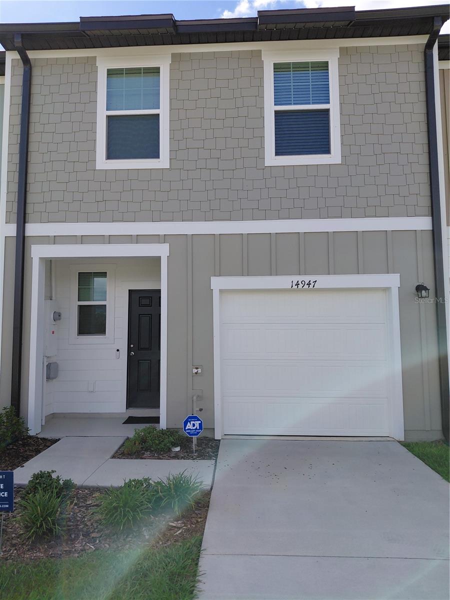 PRICED FOR A QUICK SELL! MOVE-IN READY! This townhouse is priced thousands of dollars less than other townhouses with the same square footage and made by the same builder in Dade City! Welcome to your beautifully maintained 3-bedroom, 2.5-bathroom home located in the highly sought-after Vista Walk community! Offering 1,368 square feet of comfortable living space, this two-story home is located in a prime location just minutes from I-75. Step inside to a spacious, open-concept first floor featuring generous living and dining areas for entertaining or everyday living. All three bedrooms are located upstairs, with the master bedroom having a private en-suite bathroom and an oversized walk-in closet. Enjoy the convenience of an attached garage and access to community amenities coming soon. A complete home security system with audio/video monitoring is already installed. Other upgrades include room-darkening curtains, curved shower rods and curtains, and additional shelving in the master bedroom closet. Walk across the street to the beautiful Pasco-Hernando State College East campus! There is a police and fire academy there- watch them train! Let’s make a deal!