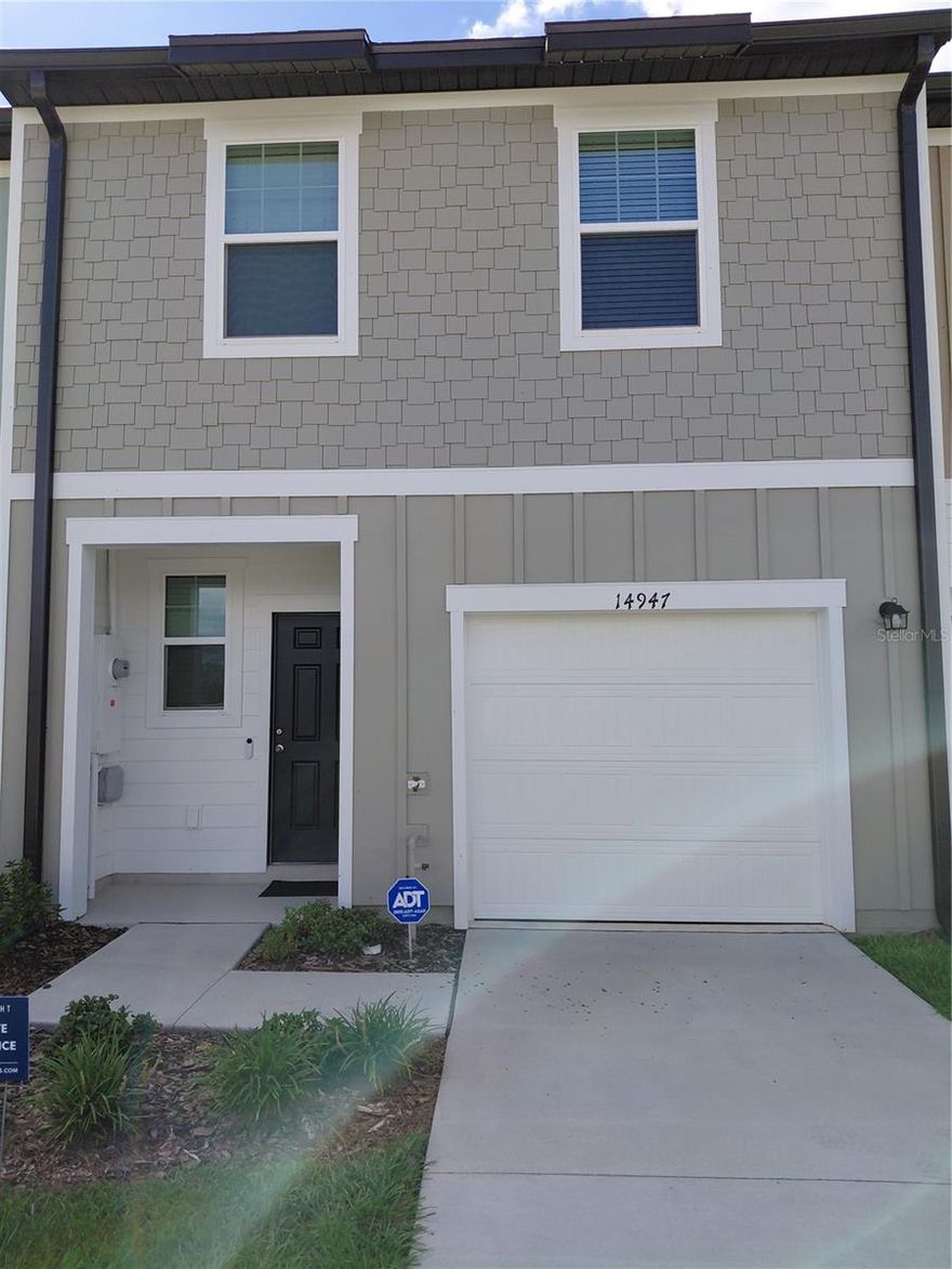 PRICED FOR A QUICK SELL! MOVE-IN READY! This townhouse is priced thousands of dollars less than other townhouses with the same square footage and made by the same builder in Dade City! Welcome to your beautifully maintained 3-bedroom, 2.5-bathroom home located in the highly sought-after Vista Walk community! Offering 1,368 square feet of comfortable living space, this two-story home is located in a prime location just minutes from I-75. Step inside to a spacious, open-concept first floor featuring generous living and dining areas for entertaining or everyday living. All three bedrooms are located upstairs, with the master bedroom having a private en-suite bathroom and an oversized walk-in closet. Enjoy the convenience of an attached garage and access to community amenities coming soon. A complete home security system with audio/video monitoring is already installed. Other upgrades include room-darkening curtains, curved shower rods and curtains, and additional shelving in the master bedroom closet. Walk across the street to the beautiful Pasco-Hernando State College East campus! There is a police and fire academy there- watch them train! Let’s make a deal!