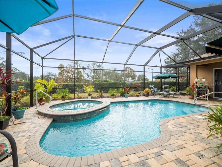 This Glen Lakes Estate Home features a BRAND-NEW ROOF completed in March 2025 with a transferable warranty, offering peace of mind from the start. Located in a private gated community on Florida's Nature Coast, Glen Lakes is surrounded by natural springs, lakes, the Weeki Wachee River, the Gulf of Mexico, and thousands of acres of protected land that provide a serene natural environment.

Built in 2007, this beautifully updated 3-bedroom, 2-bath residence offers 2,229 square feet of living space with a thoughtful split-bedroom design. A welcoming double-door entry and 8-foot interior doors set the tone for the spacious interior. The kitchen is equipped with stainless steel appliances, tall cabinets, a closet pantry, a breakfast bar, and a sunny breakfast nook. The owner's suite includes a large walk-in closet and ensuite bath with soaking tub and walk-in shower, while the two guest bedrooms are positioned on the opposite side of the home for privacy.

Enjoy Florida living at its best on the large paved, screened-in patio with recently rescreened lanai and freshly painted frame, complete with an inground pool and hot tub, all set on a beautifully landscaped corner lot.

Glen Lakes offers an exceptional lifestyle with a required HOA that includes basic cable and internet. A one-time membership due is required at closing, and Country Club membership is required with a monthly food and beverage minimum. Golf Club membership is also available.

This is a home you'll be proud to call your own, combining comfort, style, and the sought-after amenities of Glen Lakes.