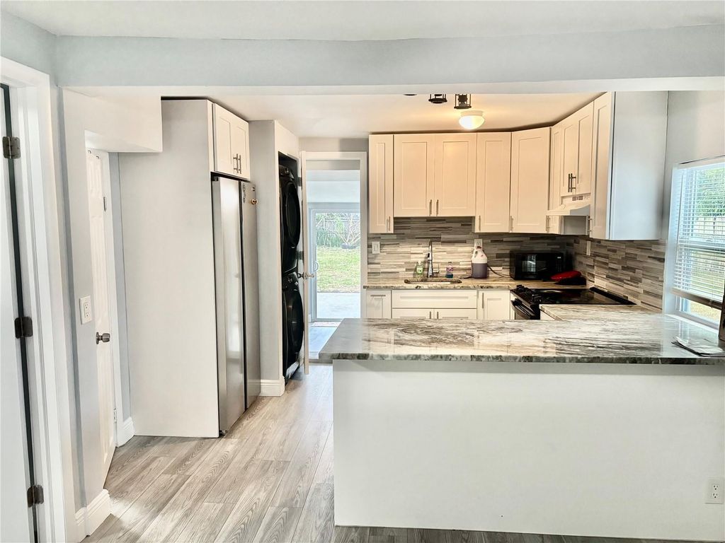 Photo of 1117 Lehto Lane, Lake Worth, FL 33461 (MLS # GC536601)