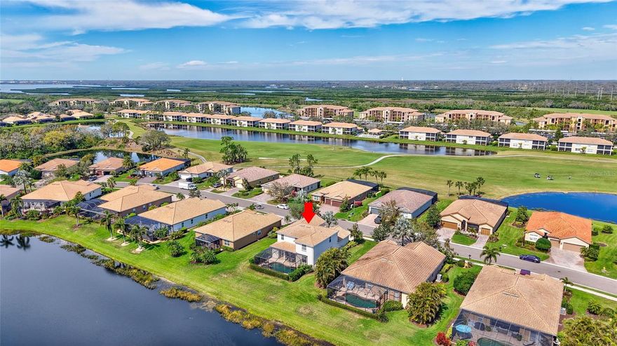 HUGE PRICE REDUCTION. MOTIVATED SELLER. Great 2-story family home in River Strand Golf & Country Club, a rare opportunity to find this Navona floor plan home with amazing lake views. This 4 bedroom 3 and half bath plus EXTRA BONUS room comes with FULL GOLF AND SOCIAL MEMBERSHIP. FULLY FURNISHED and EQUIPPED. NEW AC 2025, NEW pool heater, new pool pump, newer interior and exterior painting, flooring and furniture downstairs. MASTER Bedroom on the MAIN floor has 2 walk-in closets, his & her sinks. This solid house (any damages from hurricanes) has a large kitchen and upgraded hardwood cabinets with stainless steel appliances and granite countertops.   Sliding glass doors leading to screened & spacious lanai area with HEATED POOL/SPA. With pool you will find a half bath. Three additional bedrooms plus bonus room are on the 2nd floor. River Strand is a private gated community with 24/7 security. The 27-hole championship golf course was designed by Arthur Hills, featuring spectacular views of the Manatee River and panoramic greens and fairways. The club also offers two clubhouses, nine lit, Har-Tru tennis courts with on-site Tennis pro shop; Pickle Ball, 2 main and 6 community pools, two modern fitness centers. A beautiful 39,000 sq. ft. Tuscan-inspired main clubhouse offering casual and fine dining, a bar and grill room, billiard room, card room, conference room, golf pro shop, resort style pool with "sand" beach and tiki bar. River Strand has magnificently landscaped grounds with running and biking trails. The home is perfectly located  3 minutes from Market Place at Heritage Harbour with COSTCO and in early future with Target and a lot restaurants and stores, 5 minutes of I-75, just 15-20 minute drive to Florida's most renowned, awesome sand beaches like Anna Maria Island, Siesta Key Beach, Lido Beach or Longboat Key with an awesome little beach restaurants and tiki bars. 15 minutes from large Ellenton Outlets Mall with all famous international brands, 15 minutes UTC Mall, 20 minutes from beautiful downtown of Sarasota. Sarasota airport 20 minutes, Tampa airport 45 minutes. Enjoy the warm and sunny beaches of the Florida Gulf  Coast, and Sarasota too! Welcome Home, you will LOVE it here!
