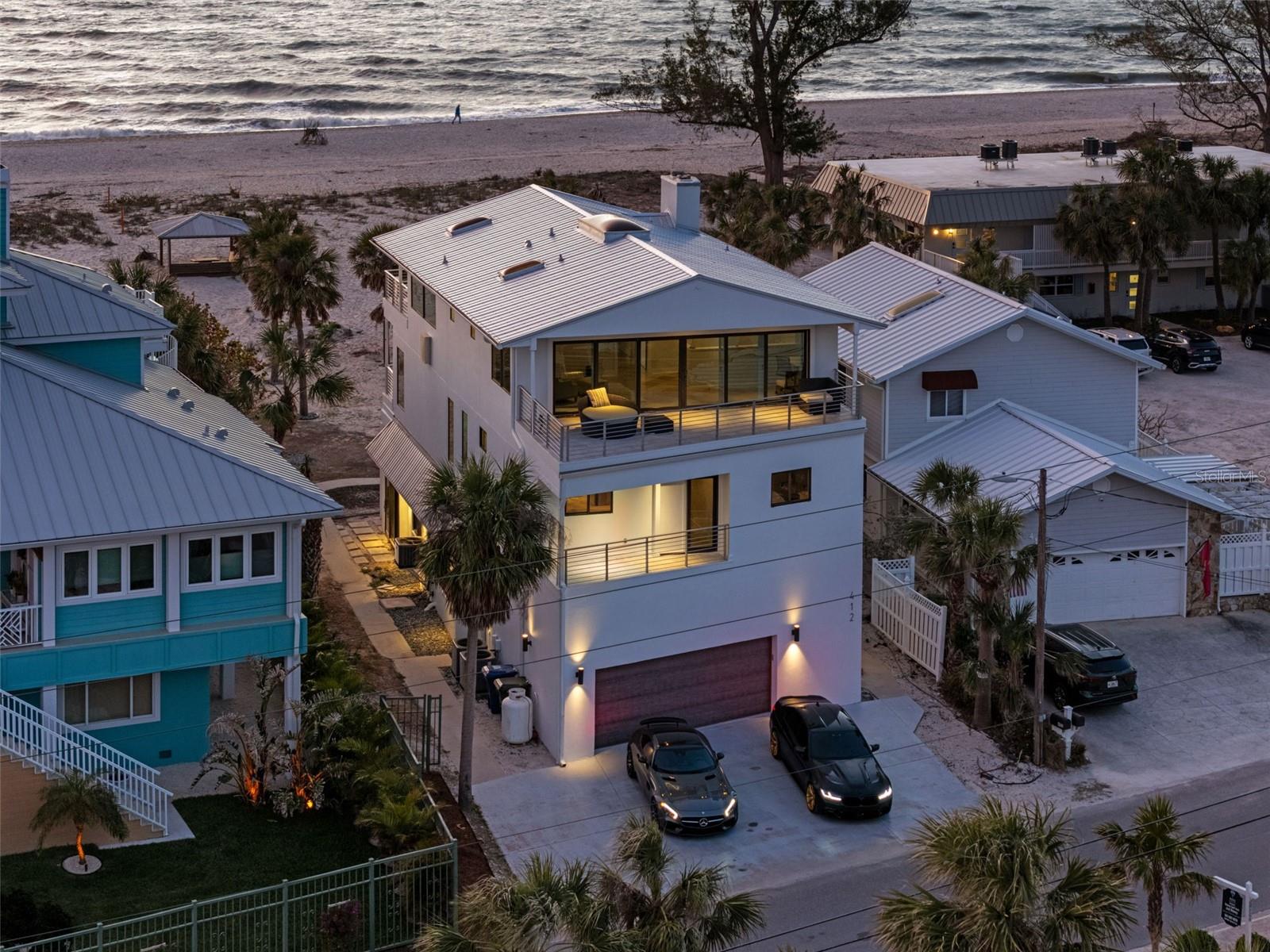 Experience the epitome of luxury living with this breathtaking beach-front estate, perfectly situated on the pristine shores of Casey Key. Offering unrivaled privacy, your backyard is the serene Gulf of America, creating an idyllic paradise for you and your family.
Originally built in 1951, this masterpiece was meticulously renovated in 2016 and again in 2025, blending timeless charm with modern sophistication. This expansive 6-bedroom, 5-bathroom home offers just under 4,000 sq. ft. of refined living space across multiple levels, ensuring comfort and style at every turn.
Designed for both relaxation and entertaining, the property boasts three living rooms, two dining rooms, and three fireplaces, providing ample space for family and guests. The gourmet kitchen is a chef's dream with a Wolf gas range with 6 burners, a griddle, and a double oven, along side with a Sub-Zero PRO refrigerator/freezer, granite countertops, and soft-close cabinets. Enjoy meals at the massive 6-chair island while taking in stunning water views.
With three balconies offering breathtaking views, you'll enjoy both the indoor and outdoor lifestyle. The home also includes a two-car garage, and a laundry room on every floor for ultimate convenience. Impressive features like impact windows and doors, travertine floors throughout (except in the kitchen, which features engineered hardwood floors, and marble tile in the bathrooms) elevate the home’s luxurious feel.
Recent updates include a brand-new metal roof installed in January of this year and a new A/C unit installed in 2023, ensuring modern functionality and peace of mind for years to come.
Additionally, this home is available turnkey furnished—ask for more details!
With exclusive access to your own private beach, this is a once-in-a-lifetime opportunity to own a premier waterfront residence on one of Florida's most coveted islands. Don’t miss your chance to call this magnificent home yours! Call us today for private tour of this beauty.
