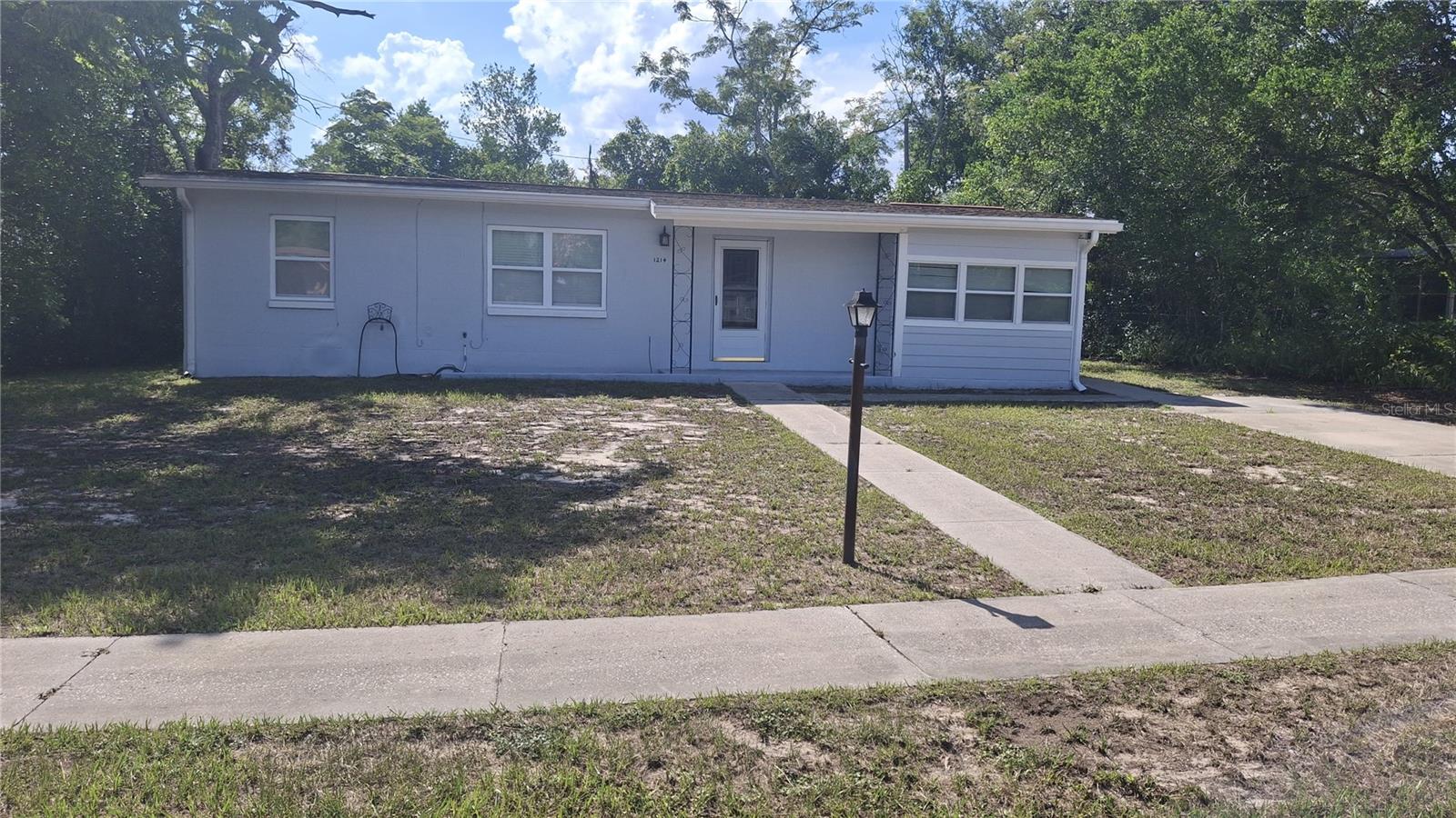 This delightful single-family home offers a cozy, peaceful retreat with no HOA. Featuring an open living space, ceramic tile floors, and a spacious backyard, it's the perfect place to relax and unwind. Enjoy the convenience of being just minutes from I-4, local dining, shopping, and area attractions. A carport adds extra convenience, and a brand-new roof will be installed within the next few weeks. Don't miss the chance to make this lovely home your own!