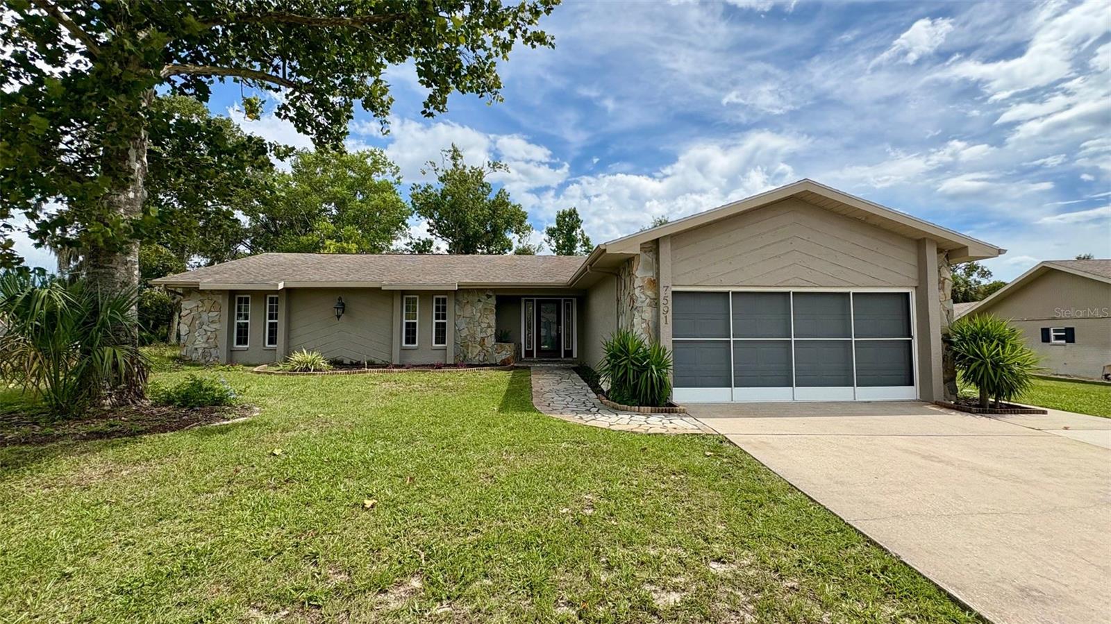 Welcome to 7591 St Andrews in Weeki Wachee FL, where comfort meets elegance in this spacious 3-bedroom, 2-bath home. With 2,020 square feet of living space this property is designed for both relaxation and entertainment. Upon entering you are greeted by a bright and inviting layout that highlights the home’s new paint and modern upgrades throughout. The expansive family room boasts high ceilings and features a charming stone fireplace providing a cozy focal point for family gatherings. Large windows allow abundant natural light to flood the space enhancing the overall ambiance. The kitchen is a true highlight of this home featuring sleek granite countertops and ample cabinet space ideal for culinary endeavors and family meals. Adjacent to the kitchen the Flex room serves as a versatile office space accommodating your work-from-home needs or could easily be transformed into playroom or hobby area. Stepping outside you’ll find a large Sunroom that adds to the home’s appeal offering the perfect space for morning coffee or evening relaxation while enjoying the serene private outdoor views. Additional features include a convenient inside laundry room, a modern solar water heater 2016, and a new A/C system 2025 to ensure year-round comfort, Roof 2015, & some newer windows 2017. Located within The Heather golfing community this home benefits from low HOA fees providing access to some local amenities. Come explore what the Nature Coast offers such as Springs, Parks, Kayaking, Boating, nearby amenities & more. This property presents an exceptional opportunity for those seeking a move-in ready home in a desirable area. Schedule your viewing today to experience all that this home has to offer!