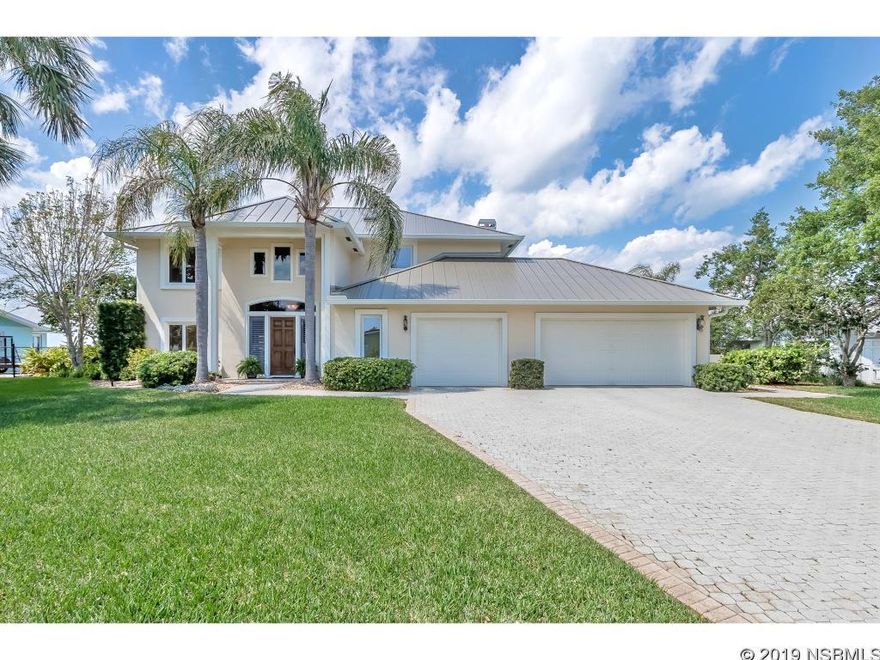 Look no further. Your dream home is here. This well maintained concrete block home sits on one of the largest boat accessible waterfront lots in all of Venezia in the heart of New Smyrna Beach. Watch the tranquil sunsets from your back yard in your lap pool surrounded by custom pavers galore. There are 2 boat lifts with private access. The roof is metal and new to withstand all that mother nature has to give. Never worry about your magnificent views being taken away as you are across from protected lands. The home offers hard wood floors throughout much of it and a new top of the line kitchen that any chef would smile ear to ear to cook in. There are 2 masters; 1 located on the ground floor as well as a second on upper level. There is a huge 3 car garage with lots of room for storage, along with plenty of closet space through out the home. Oh, did I mention the hidden full bar area : ) Do not miss this jewel of New Smyrna with one of the closest accesses points to Ponce Inlet, the main access point the Atlantic ocean. You have it all here, short walk to down town Flagler ave, hop in your boat in your back yard for some top of the line fishing in the area, or swim in your tranquil pool while you gaze at the captivating views of the areas around you. All information is intended to be accurate but is not guaranteed. ;Water: City