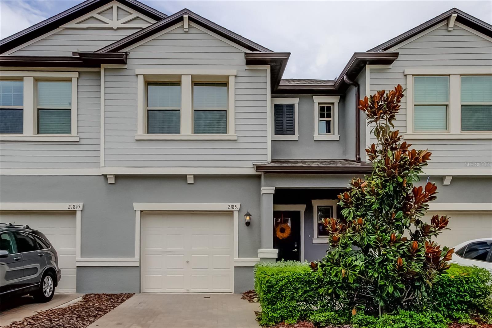 Unlock the door into modern living with this beautifully designed 3 bedroom, 2.5 bathroom townhome built in 2022. Located in the sought after Connerton Community, you'll enjoy a resort-style pool with a splash park, a lap pool, multiple sport courts, and miles of multi-use trails.
Inside, the home offers a bright and open floor plan, highlighted by smart home features for convenience and peace of mind. The spacious kitchen boasts new appliances as it flows seamlessly in to the living and dining areas, perfect for entertaining. Upstairs, you will stroll through the loft area into your spacious primary bedroom that features a gorgeous bathroom and walk-in closet. The upstairs also features 2 additional bedrooms that are well dimensioned for your family or friends to come visit.
Relax outdoors on the oversized screened in patio overlooking a peaceful green space, an ideal spot for morning coffee or evening gatherings. The garage adds extra storage and parking convenience. This home blends comfort, functionality, and lifestyle all in one, making it a wonderful opportunity to own in one of the area's premier communities. A short distance to the amazing community center, as well as the brand new community center set to be complete within weeks. Schedule a showing today and don't miss your opportunity!