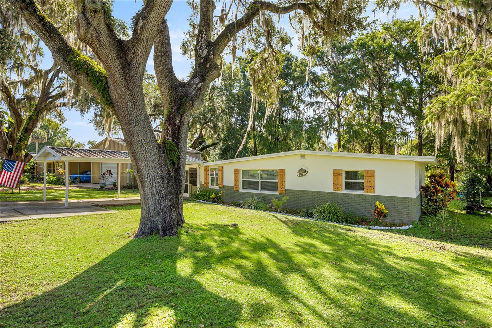 One of the best Waterfront Locations is where you will find this treasure situated on a deep and wide canal with quick access to the Open Lakes. Newer Roof, AC, Appliances, Kitchen, Bathroom, Flooring and Paint leave little for you to do. Just move in and start enjoying Life. The lush landscaping and style of this home have been done with loads of attention to details, including your own Herb Garden. The bright and cheerful Family room has amazing views of the waterfront. If Fishing is your passion this is the spot. A new deck and Boat lift are waiting for you. The Boathouse even has a live well for your bait. A 10 x 24 Screen porch is ready for cooking outside, or come into the Bright and Beautiful Kitchen with newer appliances including a stove that features an air fryer. A ampel spaced dining room fits a full size table. Oversized Laundry room provides extra storage. Two Bedrooms and a modern Bathroom complete the package.
