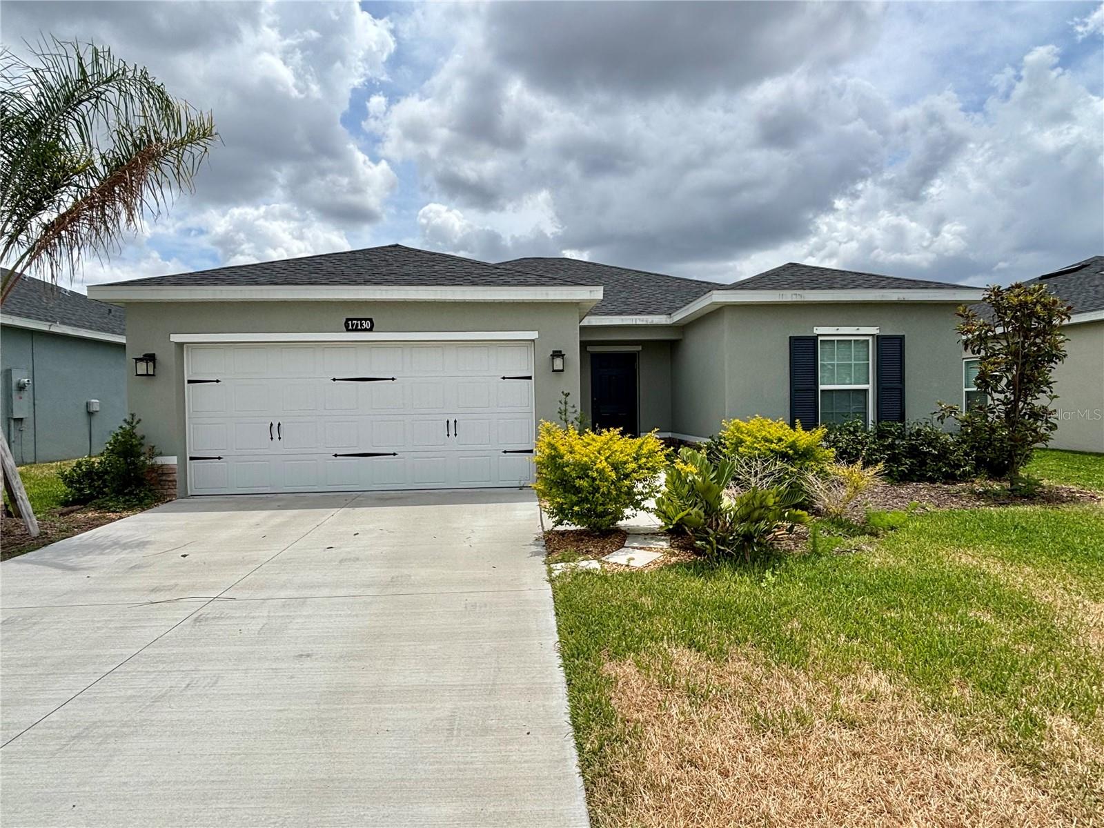 New HOME, MOVE-IN READY. Home built in 2024 but it hasn't been occupied. Conveniently located less than minutes away from the community entrance. This beautiful home is ready to have a homeowner to occupy it. Ceramic tiles throughout with the exception of the bedrooms which are carpeted. The kitchen features granite countertops, and GE stainless steel appliances. The bathrooms have quartz countertops. Very spacious walk-in closet in the master bathroom. It also includes hurricane shutters, and wi-fi enabled garage door opener. The garage has a utility sink, and the floor has been painted with epoxy. Plenty of driveway space to fit up to four vehicles. This home also has an open 12x10 lanai, perfect for grilling, relaxation, or to spend some time outdoors. This is a CDD free community and low HOA. Make your appointment to view it today!