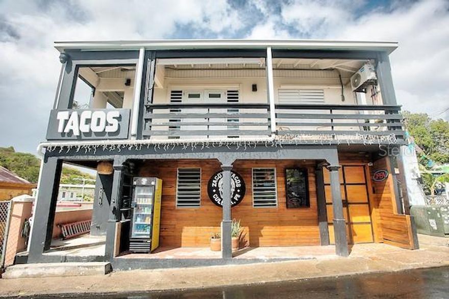 This property, Zacos Tacos, is an Iconic Culebra business with over 13 years of operational history on the beautiful island of Culebra, Puerto Rico, one of the Spanish Virgin Islands. The business is located in the center of Dewey, the main town in Culebra, just 3 blocks from the Culebra ferry dock.

The first floor of the building is Zacos Tacos restaurant. The restaurant has a full service commercial kitchen with an outdoor covered bar and dining area which seats 115 patrons.

The Upstairs/second floor of the property is a 3 bedroom 2 bathroom apartment. The apartment is currently rented as an "airbnb" short term rental unit but could easily be utilized as the Manager's and/or Owner's apartment to support the restaurant operation below.

The restaurant operation utilizes state of the art technology with regards to Point of Sale systems, "server-less" ordering systems, incoming goods and materials ordering systems, business location electronics, menu systems, security systems, redundant/back up internet services, and many other technical applications to optimize staffing and improve efficiency.

This sale includes the restaurant business, the Upstairs apartment, the property and buildings, and all supporting equipment, utensils and tools required for the operation of both businesses. The proven financial results of the business makes this property an excellent investment opportunity. In addition the hours of operation are currently 4 hours a day 6 days a week. A Buyer could decide to expand hours of operation to improve the current excellent financial performance of the property. Detailed financials can be shared with qualified Buyers upon completion of a Non Disclosure Agreement.

A fabulous opportunity to purchase turn key businesses in a central location on the beautiful Caribbean Island of Culebra, Puerto Rico.