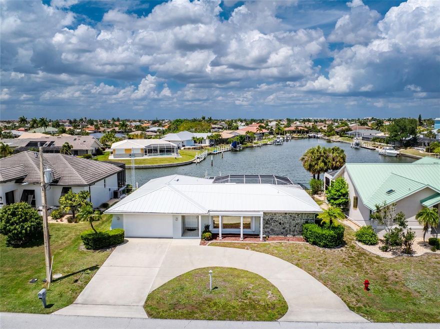 Discover your dream Florida lifestyle at 2122 Cassino Court, a beautifully remodeled 1,807-square-foot pool home. Situated on a quiet cul-de-sac in a premier waterfront neighborhood, this 3-bedroom, 2-bath residence is hitting the market for the first time in years.
Property Highlights
Boater's Paradise: Features 85 feet of water frontage on a large saltwater canal with an operating boat lift.
Kitchen: Completely updated with granite countertops and newer cabinetry.
Luxurious Outdoor Living: A massive screened lanai surrounds an impressive swimming pool, leading to a generous, fenced yard.
Split Floor Plan: The oversized master suite offers direct pool access, stunning water views, and total privacy from the secondary bedrooms.
Versatile Living Spaces: In addition to a light-filled formal living room and dining area, a large family room is perfectly positioned near the guest rooms with its own pool access.
Convenience: Includes a 2-car attached garage and a circular driveway for easy entry and exit.

Immediate Area Amenities
Located within a deed-restricted community, residents enjoy meticulously maintained surroundings where the City of Punta Gorda maintains the seawalls and canals, ensuring peace of mind for waterfront owners.
Waterfront Lifestyle: The canal systems are at least 100 feet wide, providing quick, bridge-free access to Charlotte Harbor and the Gulf of Mexico for world-class fishing and boating.
Social & Recreation: Residents can join the local civic association for various clubs and activities.
Nature & Fitness: The nearby Punta Gorda Nature Park offers 21 acres of scenic trails, a fishing pier, and picnic spots.