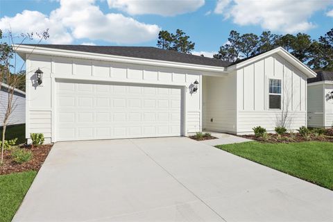 Photo of 51 Wandering Creek Way, Palm Coast, FL 32164 (MLS # O6350112)