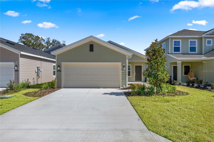 This new single-story residence features an open-plan layout designed for modern living. A covered front porch leads into a well-equipped kitchen with a center island, while at the back are the dining room and a spacious living room. Nearby is a screened porch to extend activities outdoors. On the opposite side of the home are two secondary bedrooms and a serene owner’s suite complete with an attached bathroom.