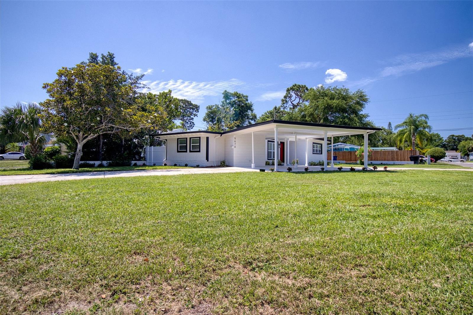 Situated on a corner lot this updated split plan 3 bedroom and 2 bath home is located nearly in the middle of St Petersburg. In the middle of downtown and the beaches with nearby shopping. Featuring a beautiful kitchen, and a carport located on a corner lot with circular drive.
Fenced in back yard that includes a stand alone one room dwelling which could be put to so many different uses as it has air condition and lights.
