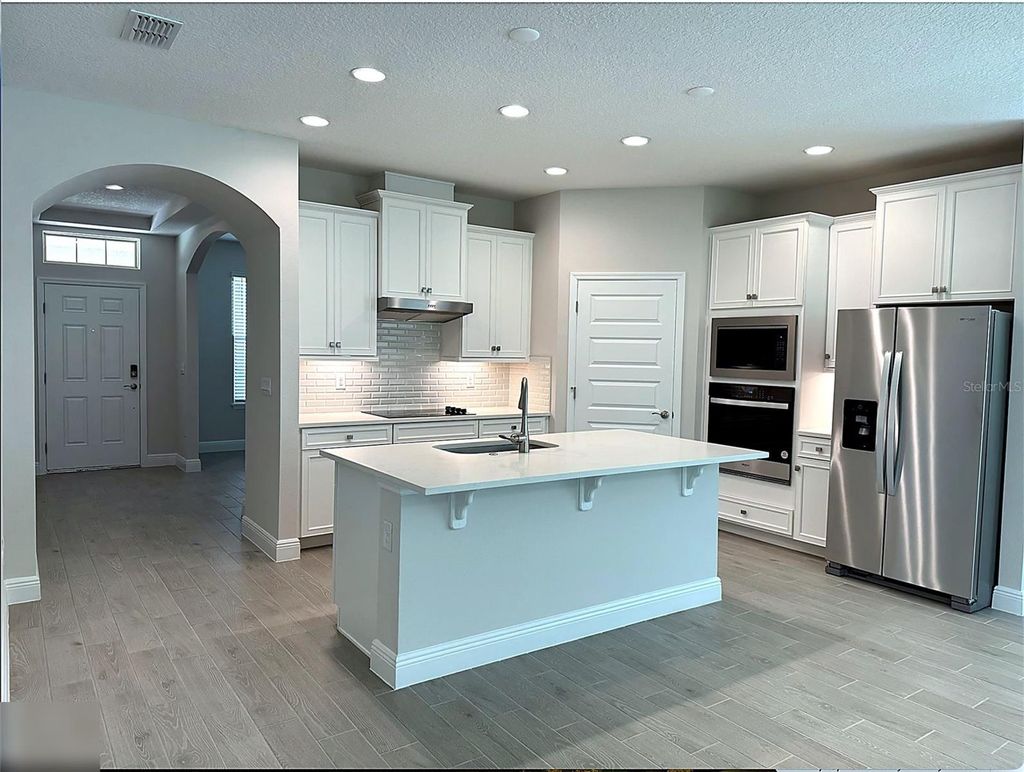 Photo of 18386 Oliver Twist Way, Winter Garden, FL 34787 (MLS # O6388830)