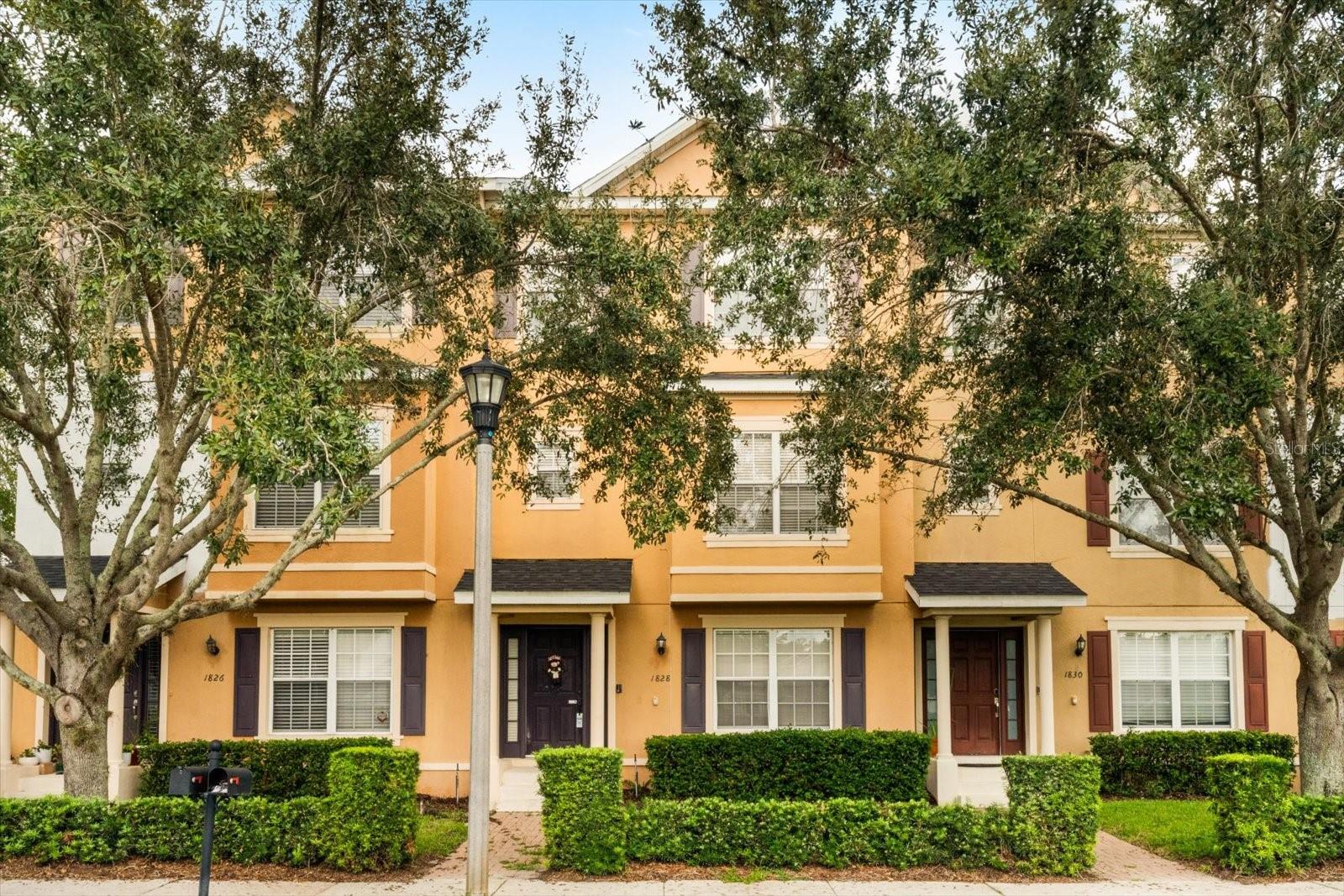 BEAUTIFUL and SPACIOUS townhouse with over 2100-sqft. No worries about any exterior headache - as the roof is even covered by the HOA! Upon entry to the first floor, you will find new tile, and the first floor ensuite bedroom, perfect for guests or as a 2nd master bedroom! Heading up the stairs, you will find a spacious floor plan, with the kitchen, featuring new appliances and backsplash. To the left of the kitchen is a formal dining area, with a serving window from the kitchen. Back past the kitchen, you will find a long bar, perfect for a quick meal, and an open living room area with plenty of natural light pouring in. Past the living is a powder bathroom. On the third floor you will find a laundry area, and to your right there is a full sized bathroom with new granite, and two bright bedrooms. Tucked away privately on the third floor is the massive bright master bedroom - featuring a walk-in closet - as well as an ample sized master bathroom with double sinks, tub and shower. This home features engineered hardwood throughout, as well as new plumbing fixtures, as well as a 2 car oversized garage, located conveniently in Casselberry, close to everything - come see this home today!