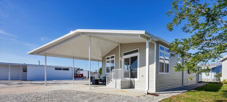 A COASTAL DREAM! This 2020 Jacobsen model offers Two bedrooms and Two baths, featuring sky-high 9' ceilings, high transom windows and bright, open-concept living in the highly desired, 55+ Trailer Estates waterfront community. Buyers wait months for new models to be manufactured and installed, but you can MOVE right in! Beautiful Kitchen is open with ample cabinets, quartz and granite countertops, and a breakfast bar/island. All drywall interior and crown molding throughout. Large Primary Bedroom with ensuite bath. Inside Laundry room. Wide oversized carport and a 10' x 9' shed. If you hurry, the owner has listed the adjacent vacant land property at 6510 Washington St (MLS #A4631739) for sale to build your dream Garage on! You own the land. Boaters have direct access to Sarasota Bay from the Marina. Enjoy the large, heated community pool, hot tub, gym and wood shop. The community buzzes with pickleball, shuffleboard, kayaking, horseshoes, bocce, dancing and more. A US Post Office on site. 10 minutes to Sarasota-Bradenton Int'l Airport. Convenient to shopping, restaurants, the Arts and everything in Bradenton/Sarasota. Begin your Florida Lifestyle HERE.