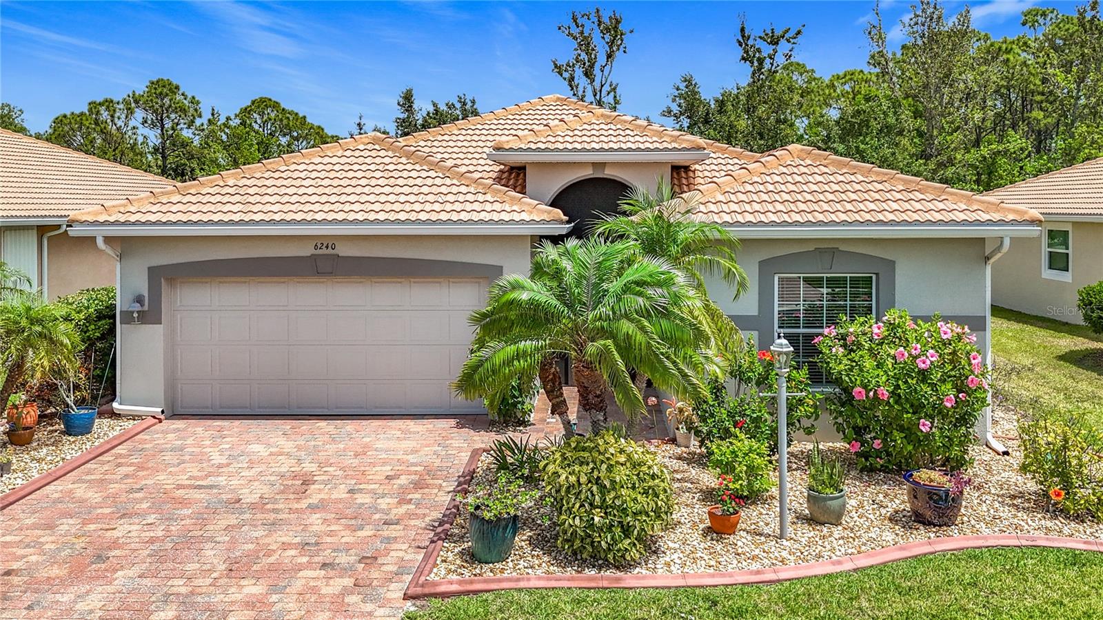 Welcome to Talon Bay, a friendly community close to Wellen Park with no CDD fees! This move-in-ready D.R. Horton "Pembrook" model is a must-see. The home features stylish upgrades, including 18"x18" diagonal tiles in the main living areas, 42" kitchen cabinets with crown molding, Corian countertops, and stainless steel appliances. A Delta touch faucet adds convenience, while recessed lighting in the living room, upgraded bathroom tiles, and plank ceramic tile in the bedrooms elevate the space. The indoor laundry room includes a utility tub for added practicality. The AC is well-maintained with a service contract, and the home benefits from preventative pest control and a roof cleaning contract to keep the barrel tile roof looking fresh. The exterior was recently repainted, the front entry is newly screened, and the garage boasts a fresh epoxy floor and new paint in 2025. City water, sewer, and irrigation ensure easy maintenance and a lush lawn.
Backing up to a peaceful wooded area, this home offers quiet evenings and is just steps from Talon Bay’s fantastic amenities, including a spacious clubhouse, large heated pool, covered grilling area, tennis courts, and scenic sidewalks. Located only a few miles from Downtown Wellen Park and CoolToday Park. A short drive to Venice Beach, Manasota Key, top golf courses, dining, and shopping, this home strikes the perfect balance of relaxation and convenience.
Talon Bay spans 101 acres with small lakes, nature trails, and a canoe launch for exploring Myakkahatchee Creek, surrounded by beautiful Everglades-like scenery and wildlife. This is a home and lifestyle you’ll love!