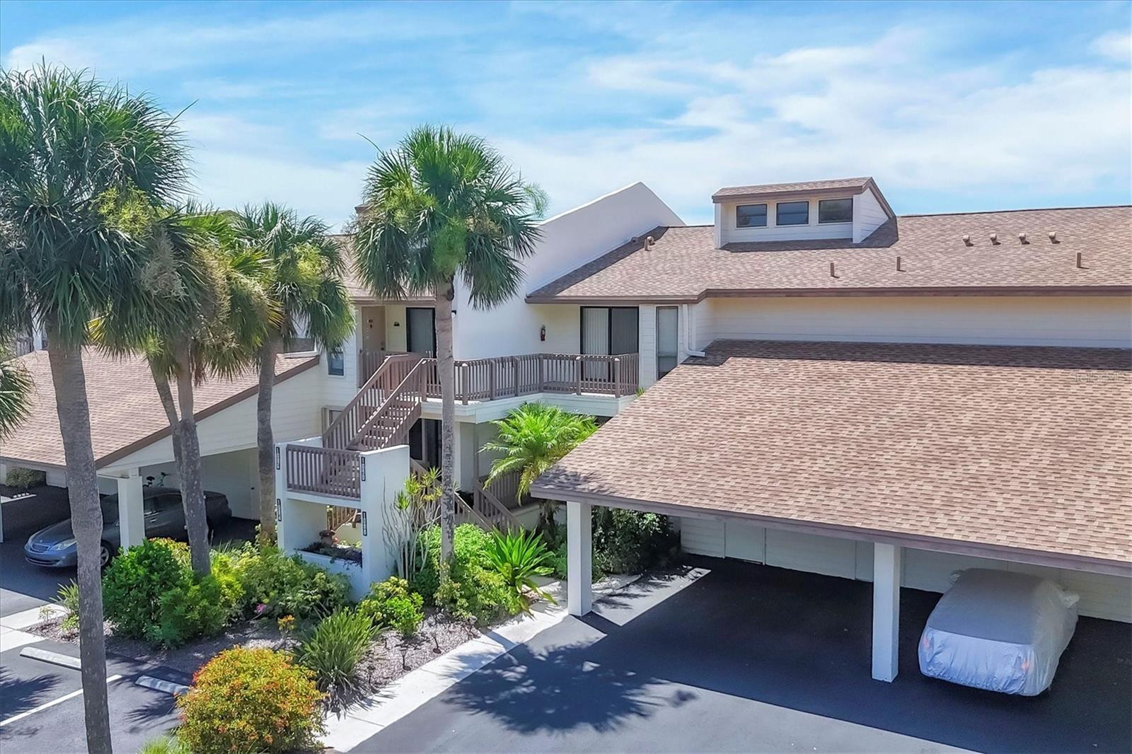 Rarely available and highly sought-after resort-style condo in the heart of Venice at Bird Bay Village! Welcome to your private retreat in this spacious first-floor split-floor plan condo offering over 1500 sqft of comfortable living space including the expansive screened lanai and private front patio. This 2-bedroom, 2-bath haven provides privacy and function with beautifully remodeled bathrooms and stunning wood-look laminate floors throughout with tile in the kitchen and bathrooms. Enjoy breathtaking sunsets and tranquil views of Roberts Bay with mature trees and mangroves from your expansive lanai. Both bedrooms and living room feature glass sliders that lead to the lanai that looks and feels like you're in a tree house! The back and front sliding doors all have built-in hurricane shutters for your peace of mind. The spacious and bright kitchen opens to a charming patio through sliding glass doors—perfect for morning coffee or evening relaxation. Nestled in the peaceful community of Bird Bay Village, you'll enjoy access to 3 community pools, a clubhouse, tennis and pickle ball courts, fitness center, a library, shuffleboard and bocce courts, and your private carport and storage shed. Close to downtown Venice full of wonderful restaurants and unique shops, boutiques, galleries, our beloved Venice theater for the performing arts, endless entertainment possibilities, and our world-famous Gulf Coast Beaches. Whether you're looking for a peaceful primary residence, a snowbird escape, or an investor-friendly property with strong rental potential, this is your opportunity to own a move-in ready gem in a premier location with access to the Legacy Trail, Venetian Waterway Park bike trail and Sarasota Memorial Hospital. The HOA fee covers Grounds Maintenance, Exterior Maintenance, Manager, Pest Control, Cable TV, Water, Trash, Sewer, Common Area Taxes, Community Pool, Pool Maintenance, Escrow Reserves Fund, and Recreational Facilities. This move-in ready gem offers the perfect blend of serenity, convenience, and Florida lifestyle. It's truly a haven that you'll never want to leave!