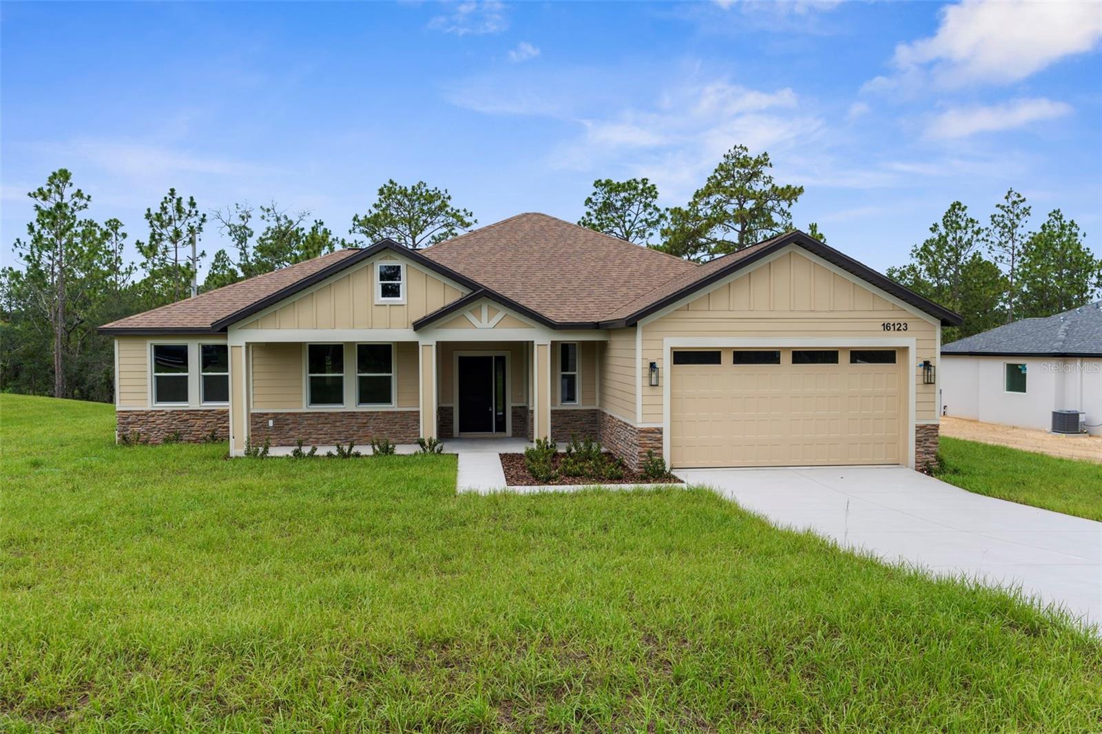 STUNNING...Brand New Craftsman-style Luxury Home!! 4 bed /2.5 baths /2 car garage!! Check out the Builder's Signature Mudroom and Laundry Room in this model!! PAVED ROAD!! NO HOA!! NO FLOOD!! NO REAR NEIGHBORS!! MOVE-IN READY!!! This stunning home offers 4 large bedrooms + 2.5 bathrooms + 2 car-garage! It boasts a beautiful, inviting front porch to decorate for the holidays!! The builder added board and batten on the exterior of the home with stacked stone accents...this all adds to its country appeal...this is NOT your standard basic "Spring Hill stucco home!"
This is a large home with 2,131 sq ft living space; 2,839 total. The entryway & front door welcomes you and your guests into the grand center of the home with a large open great room, island-style kitchen and dining room all with 10' ceilings! The high ceilings and open floor plan makes this home feel spacious, light, bright, and cheery...where your family can gather for years to come!
Every inch of this custom home is upgraded and attention was paid to every inch and every detail including designer faucets and lighting, upgraded baseboards, upgraded windows/sliders, and continuous Luxury Vinyl Plank flooring throughout the entire home (no carpet)! The upgraded kitchen offers stunning QUARTZ countertops with the modern large, single-level island with breakfast bar big enough for the whole family! Real wood upgraded 42'' soft-close cabinets with a stunning backsplash for that finished luxury look and feel. New stainless steel appliances! LARGE WALK-IN PANTRY!
The home has a split floor plan offering privacy to the owner's suite with a large ensuite bathroom! Double doors open up into the private master bedroom with a high tray ceiling and two large walk- in closets! The ensuite bathroom is a SPA RETREAT in itself with a large stand-alone, modern soaking tub, separate over-sized, floor-to-ceiling tiled walk-in shower and designer shower head and frameless glass door, dual granite vanities and dual sinks, matching real wood upgraded cabinets with framed mirrors, designer faucets and lighting, and a separate toilet room for privacy!
There is a half bath off the great room for your guests! On the opposite side of the home are the additional generously-sized bedrooms with a second full bathroom. This is no ordinary second bathroom!! This has dual granite VANITIES and dual sinks...and the toilet and shower are separate, so family members can still use the vanity area while others are showing. GREAT DESIGN!
Sip your coffee on your large back covered patio in the mornings! Multi-zoned sprinkler system & landscaping! Brand NEW well and septic!! Everything is brand new!! Zoned for the county's newest schools Winding Waters K-8 and Weeki Wachee High School!
Built by LDT CONSTRUCTION...an impressive builder with luxury upgrades and design features...all at great prices for you and your family!! BUILDER'S 2/10 WARRANTY!! Quality Custom Builder.Other spec homes available; call for details.
Minutes from shopping, restaurants, movies, schools, Buccaneer Bay Water Park, kayaking the crystal clear Weeki Wachee River, sunsets at Pine Island, boating, fishing, swimming w/the manatees. 1 hr to Tampa & TOP US BEACHES!