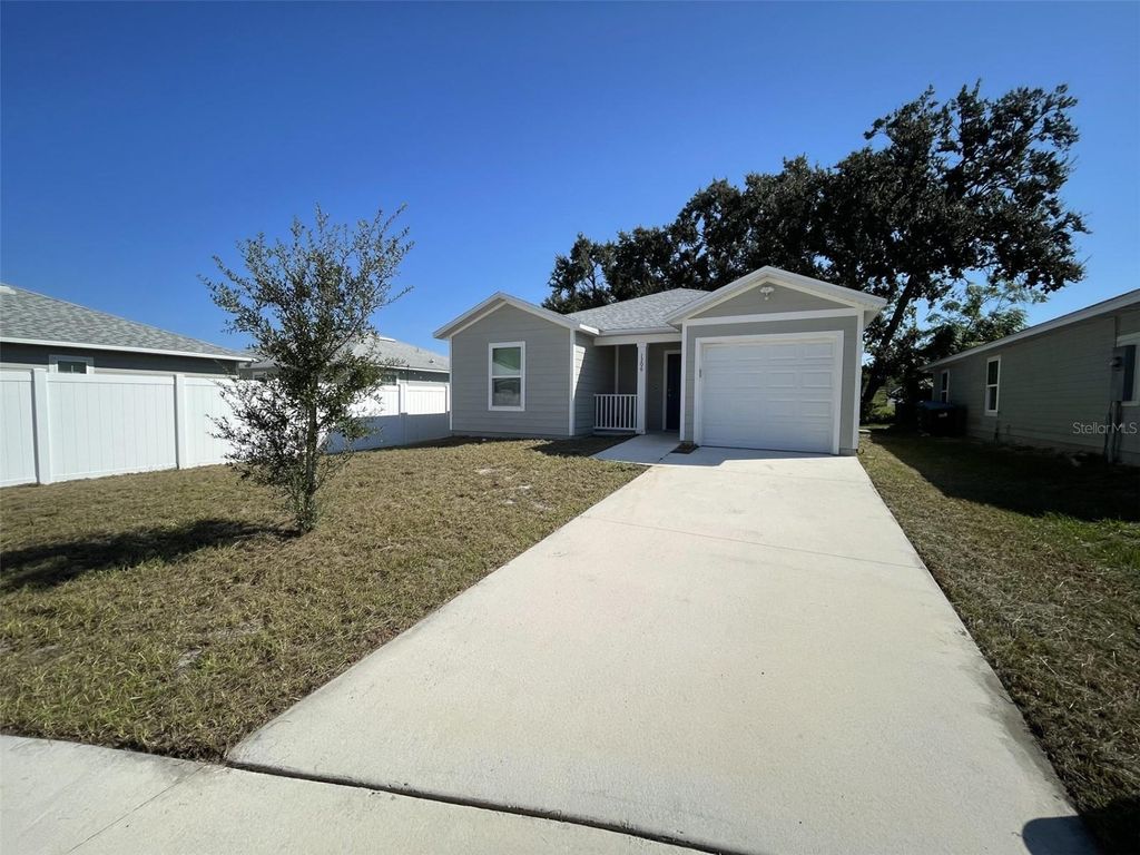 Photo of 1306 Ridge Pointe Dr, Orlando, FL 32808 (MLS # O6355123)