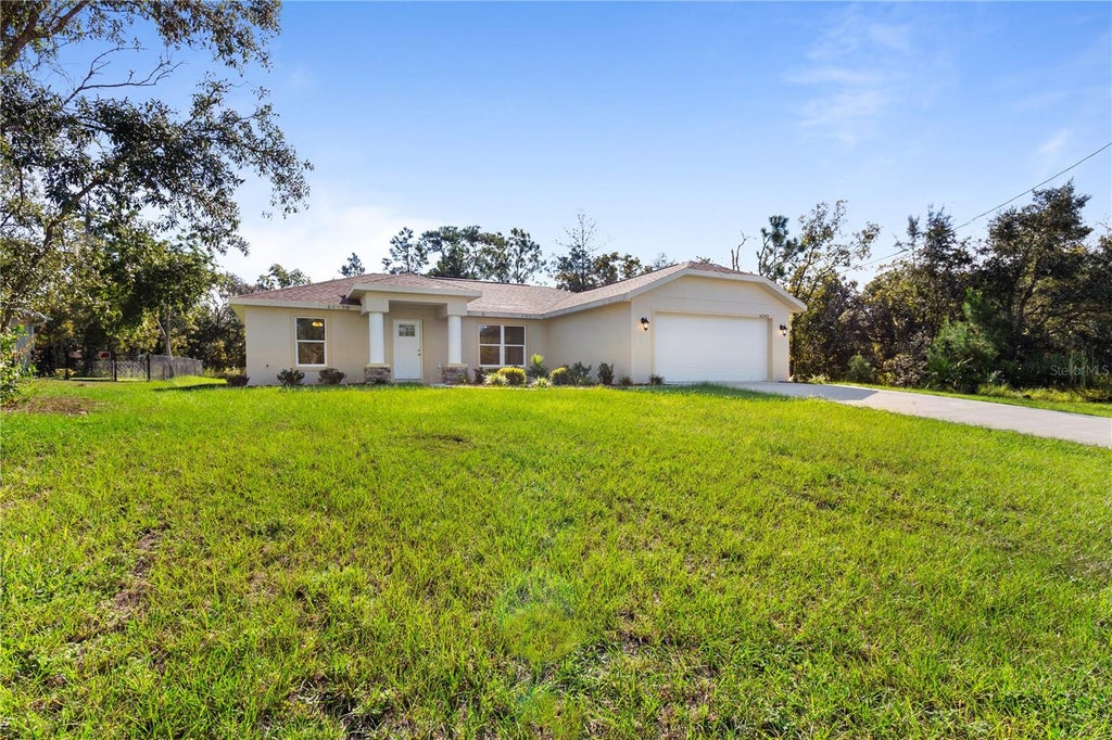 Photo of 6243 N Matheson Divide, Dunnellon, FL 34434 (MLS # OM733464)
