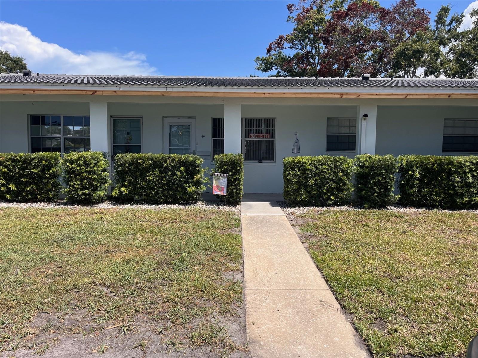 This renovated 2/2 condo is in Twin Oaks, a 55+ 13 acre park-like community minutes from large parks and Pinellas Trail access. The condo has an oversized living room/dining room, large kitchen, and a sunroom overlooking the lovely backyard. The large kitchen has many cabinets, a pantry, and brand new black & stainless appliances. The unit also features new flooring and abundant closet space. Directly across the parking lot is the pool and the clubhouse with pool table, laundry and library. Cats are permitted with restrictions. There is one assigned parking space, and many other spots are available. This is no-evacuation-zone ground-level unit.