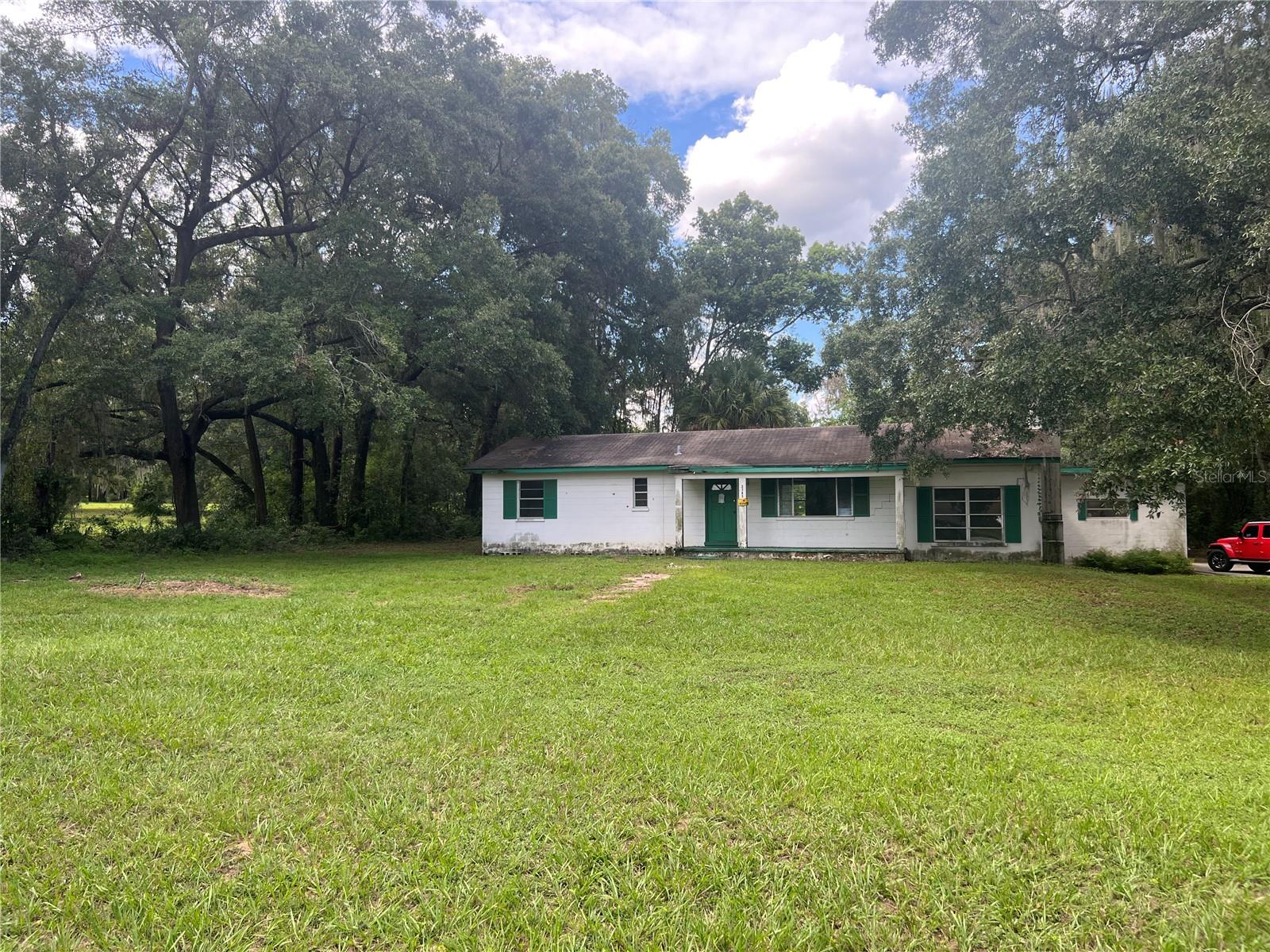 This 3 bedroom, 1 bathroom home is full of potential and just waiting for the right owner to bring it back to life! Located within city limits on a high-traffic road, this property sits on a generous 1.97-acre lot and is zoned RO (Residential Office)—ideal for a variety of residential or business uses. The home features carpet in the main living areas and bedrooms, a spacious family room with concrete floors and a fireplace, and a kitchen with a cooktop and wall ovens. A 2-car carport, storage shed, and 24x30 workshop/barn offer plenty of room for projects, equipment, or small business operations.
While the home needs some TLC, the possibilities are endless. Whether you're looking to renovate, invest, or start a business, this property is a rare opportunity. Conveniently located close to schools, shopping, and major highways, the location offers high visibility and easy access. Bring your vision and make it your own!