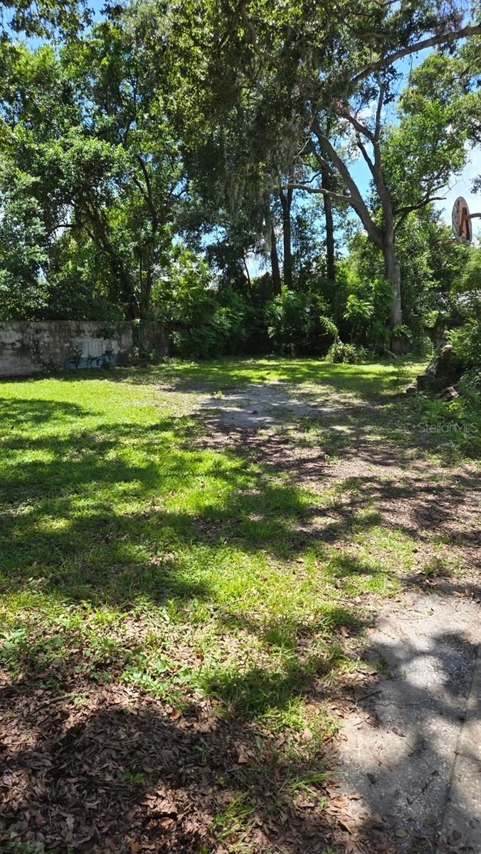 Listing agent has new phone number - see realtor only remarks. High and Dry 49x135 lot with alley access in Tampa's hottest neighborhood, Seminole Heights! High and dry, non flood zone. Walking distance to Angry Chair, Florida Avenue Brewing Co. A short drive from Spaddy's coffee, The Salty Donut, and Trip's Diner. Easy access to I-275 and I-4. Five minutes away from downtown Tampa and Armature Works. This pocket of Seminole Heights has new construction homes in every direction, ranging from $900k-1.4MM. Lot has a block fence around perimeter that can be modified to buyers liking. Certified Lot Letter from City of Tampa was issued on 7/2/25 stating 4010 N Central Ave is a buildable lot, as it has existed as a lot prior to July 1, 2010 (Sec 27.211.2.1 City of Tampa Code). Lot Letter is available in attachments. 4012 N Central is undergoing a top to bottom renovation as well!