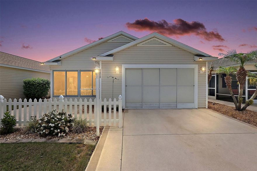 One or more photo(s) has been virtually staged. Discover this warm, welcoming, and wonderfully located 2/2 Colony Villa nestled in the heart of The Villages in the highly sought-after Village of St Charles! IDEALLY LOCATED halfway between Lake Sumter Landing and Brownwood Paddock Squares with shopping, dining, and live nightly entertainment! LOW BOND - only $6,088.95! Welcoming you to this INCREDIBLE home are TROPICAL landscaping with curbed stone beds, DECORATIVELY PAINTED drive and walkways, and SPACIOUS FRONT and SIDE PATIOS - perfect for gathering with family and friends or enjoying quiet outdoor relaxation! Inside, the EXPANSIVE living and dining rooms boast HIGH VAULTED CEILINGS, PENDANT LIGHTING, an OPEN CONCEPT layout, and an ABUNDANCE of NATURAL LIGHT from TWO sets of DOUBLE windows along with SLIDING GLASS doors that open to the EXTENDED side patio, seamlessly blending indoor and outdoor charm and offering easy convenience for grilling and outdoor dining. The AMAZING kitchen is thoughtfully designed with LUXURY VINYL PLANK flooring, WOOD cabinetry, PULL-OUT SHELVING, NEUTRAL countertops, PANTRY closet, EAT-IN  breakfast bar, and a quaint DINETTE - creating a natural gathering spot—ideal for casual meals or entertaining. The primary suite offers VAULTED ceilings, a LARGE window, and a GENEROUS L-shaped WALK-IN closet. Its en-suite bathroom features a WOOD vanity with NEUTRAL top and a WALK-IN shower. Bedroom two has a VAULTED ceiling and built-in closet. The second bathroom features a WOOD vanity with NEUTRAL top, tub and shower combination, and a convenient hall LINEN closet. Completing the package is an 18’x22’ garage boasting an EPOXIED floor, dedicated laundry nook with shelving, utility sink, sliding garage door screen, attic access with stairs, Kenmore Elite Water Softening System, and PLENTY of room for parking and storage! DON’T MISS YOUR OPPORTUNITY to make this FANTASTIC HOME YOUR OWN! The Hallandale Villas in the Village of St. Charles are IDEALLY LOCATED between Lake Sumter Landing and Brownwood Paddock Squares. Close to Seabreeze Regional Recreation Center; St Charles, Allamanda, Liberty Park, St James, and Sterling Heights Neighborhood Recreation Centers and Pools. This location is a GOLFER'S DREAM - Cane Garden, Havana, and Evans Prairie Country Clubs; Yankee Clipper, Southern Star, Sandhill, and Turtle Mound EXECUTIVE COURSES! Also you'll find Trailwinds, Colony, and Sarasota Plazas along with CR 466A with an abundance of shopping, dining, banking, medical, and more! PLEASE WATCH OUR WALKTHROUGH VIDEO of this WONDERFUL HOME in an AMAZING LOCATION and call today to schedule your Private Showing or Virtual Tour!