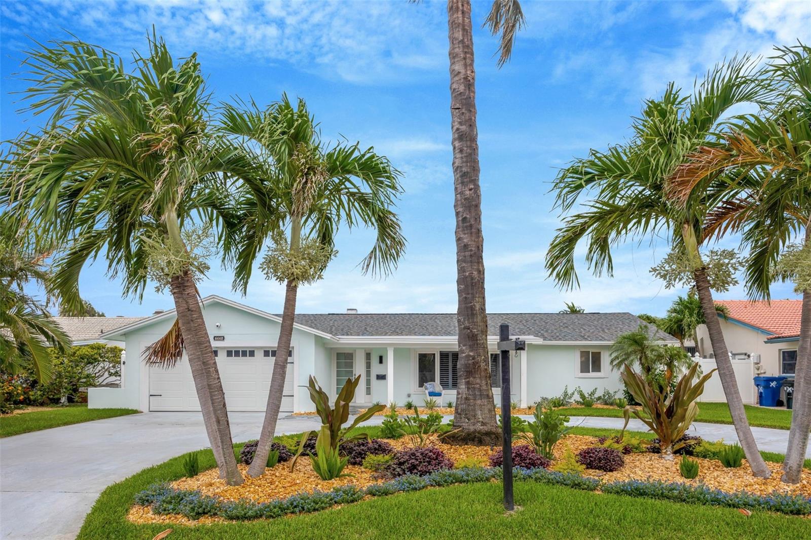 Florida Living at it’s BEST on the water, with a boat lift/dock/jet ski pad, salt water pool and spa! This amazing home is located on 3rd Palm Point, one of the Gulf Beaches most desirable waterfront neighborhoods, and so close by boat to countless sandbars, islands, beaches and the Gulf of Mexico while minutes by golf cart or bicycle to beautiful St. Pete Beach, shops and restaurants! This coastal home, with over 2300 heated sq feet of multiple living areas, features a chef’s dream with an open concept kitchen, NEW gorgeous granite countertops, NEW wood cabinets with pull- out hidden features, breakfast bar, NEW stainless steel appliances, dry bar with lighted glass front and a NEW wine refrigerator; perfect for gathering inside or out! The kitchen ebbs into the family room with a wood-burning fireplace, flatscreen TV and built-in custom storage cabinets while also flows into the Florida room and Flex Office Space with triple panel sliding pocket doors for indoor or outdoor dining and entertaining. The expansive living room is perfect for relaxing and enjoying a movie or captivating book. The split bedrooms provide so much privacy; the primary master suite overlooks the waterfront, also with 3 panel sliding pocket doors providing direct access to the paver pool deck, enormous walk-in closet and bath with dual sinks, generous storage, and double head glass enclosed shower. Spacious 2nd bedroom also offers as sitting area and in-suite bath with tub/shower. While the 3rd bedroom, off the family room, utilizes a huge bath with a glass enclosed shower. The interior laundry room houses NEW LG front loaders and ample storage space. An oversized garage gleams with a sealed floor, while other features include a half governor’s driveway, whole house water softener, propane tankless hot water heater, hurricane windows with sliders, salt water pool, propane-heated spa, and concrete brick paver deck. The private dock is a Boaters personal oasis with Trek planks, 10,000 lb boat lift, on-site water/electric, storage, and a floating dual jet ski pad! It is so easy to soak in endless sunsets with 500 sq.ft covered lanai space, 1500 sq.ft of pool/deck and 250 sq.ft of private dock – all on Boca Ciega Bay. Don’t delay any longer and experience YOUR new Florida lifestyle in YOUR new waterfront home!