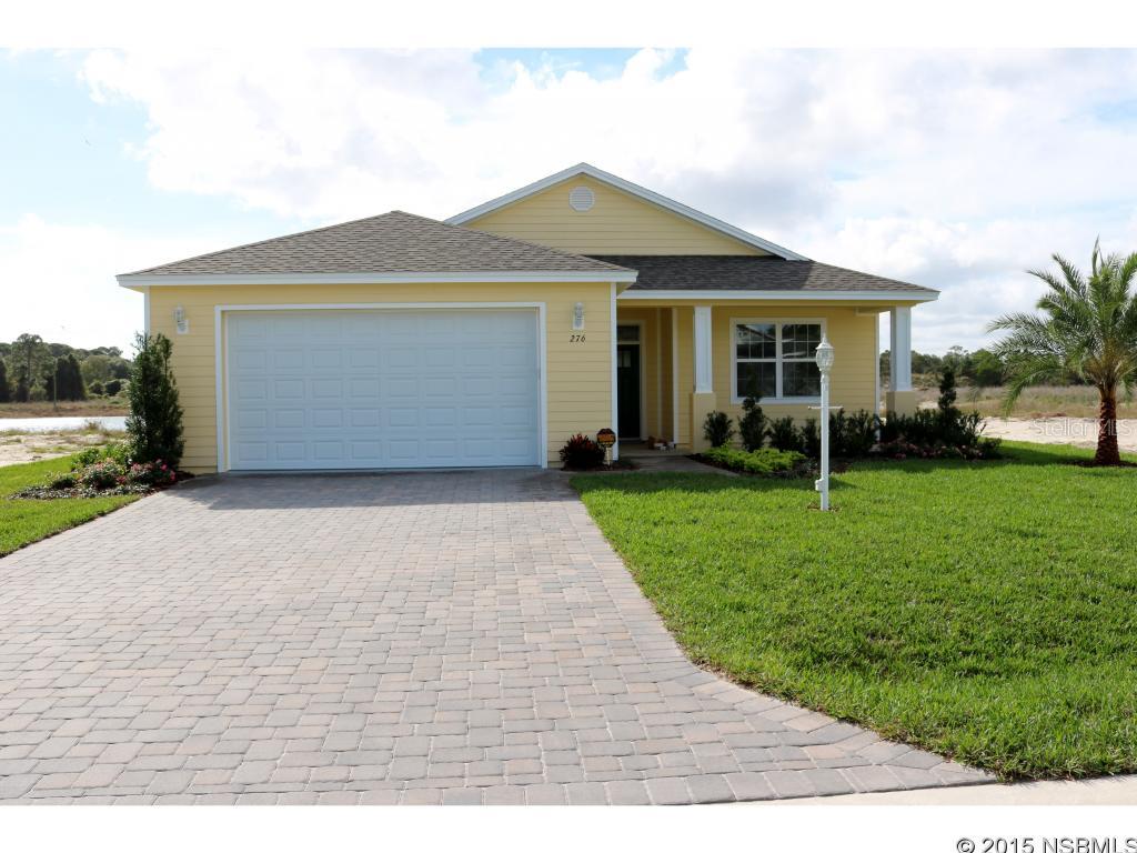 Come enjoy Florida living at its finest! Brand New Construction. Own your own land, not a rental community. This beautiful three bedroom, two bath home is perfectly situated on a small lake in the newest phase of Lighthouse Cove. Enjoy gorgeous views of the lake from the kitchen, dining area, great room and master bedroom. Spend the afternoon unwinding on your large screened in patio while watching the abundance wildlife. Some incredible features of this home include cathedral ceilings throughout, a master chef's kitchen with solid wood cabinets, granite countertops and stainless steel appliances. The luxurious bathrooms include solid wood cabinets with granite countertops and quality Moen chrome faucets. Lighthouse Cove is a one-of a kind premier active lifestyle gated community located on the Intracoastal Waterway in Oak Hill and amenities include a clubhouse, heated swimming pool, tennis and shuffleboard courts, a small boat launch, fishing pier and boat dock with boat slips. Activities galore. Own your own land, not a rental community. Oak Hill was named by Zillow as one of the best places to buy a vacation home for outdoor adventures. This home will not be available for long. A must see! All measurements approximate. ;Water: City