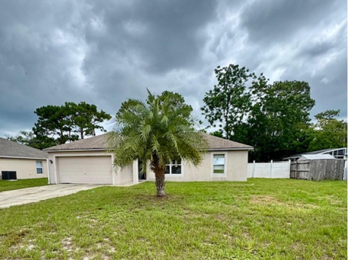 Investor Alert! This 3-bedroom, 2-bath home is located in the heart of Deltona's popular Deltona Lakes community and offers strong potential for the right buyer. The split-bedroom layout and open floor plan provide a functional foundation, while the large 2-car garage adds valuable space and convenience. This concrete block home is in need of cosmetic improvements but sits on solid bones in a great location. Whether you're looking to renovate and resell, add to your rental portfolio, or create long-term value, this property is a prime opportunity to build equity and make it your own.