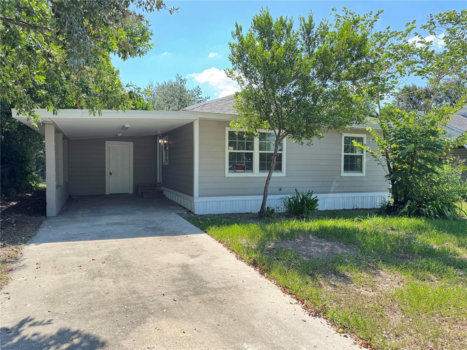 Welcome to this beautifully updated 2-bedroom, 1-bathroom home in desirable Auburndale, FL! Though compact at 672 sq ft, this home is huge on possibilities and style. Step inside to an open floor plan with high ceilings that create a bright, airy feel. The modern kitchen features granite countertops, stainless steel appliances, and plenty of workspace—perfect for cooking and entertaining. A separate laundry room adds convenience, while the covered carport keeps your vehicle protected year-round. Enjoy the spacious private backyard—ideal for relaxing, gardening, or future expansion. This home delivers comfort, function, and opportunity. Located just minutes from major freeways, shopping, and schools, this move-in-ready gem offers the best of small-home living with room to grow. Schedule a private tour today!