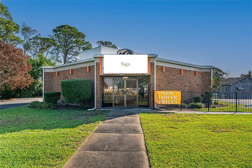 Opportunity to acquire income-producing investment with a solid lease already in place with a recognized national chain take-out restaurant. Whether you’re an investor seeking investment returns or looking to add a low-maintenance asset to your portfolio, this property delivers strong fundamentals: high-traffic location, quality construction, and a proven national tenant already in place. Located on high-visibility corner lot on US-1 / Ridgewood Ave – one of the busiest corridors in the area with an Annual Average Daily Trip (AADT) of 27,000 and excellent accessibility with a bi-directional median cut. Low maintenance brick commercial building on a corner lot that is nicely landscaped with underground utilities and a newly resurfaced parking lot. The sale includes the building and both parcels with approximately 200’ of Ridgewood Ave. frontage. The property is located in the CRA District as well as the Opportunity Zone. The active lease is fully transferable, providing income cash flow with a nationally recognized tenant. The business operations, equipment, and inventory are owned by the restaurant and are not included in the sale. Information is assumed accurate but not guaranteed.