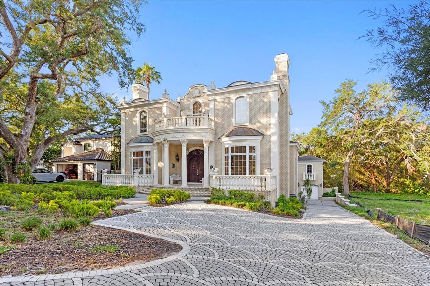 One or more photo(s) has been virtually staged. Grand Belleair Estate – European Elegance, Endless Potential!!
Step into timeless elegance with this over 6,000 square foot masterpiece, gracefully situated on an **almost half-acre lot** in one of Belleair’s most sought after neighborhoods. Featuring six spacious bedrooms and five and a half bathrooms, this estate offers a rare opportunity for those seeking a luxurious blank canvas — ready to personalize while embracing its opulent European-inspired interiors.

Designed with influences from the Baroque, Rococo, and Neoclassical eras, the home's intricate moldings, soaring coffered ceilings, detailed woodwork, and lavish finishes create an ambiance reminiscent of a European palace. Whether you are drawn to the romantic grandeur or envision blending classic beauty with contemporary upgrades, this estate invites your imagination.

The main residence features a grand two-story formal living room adorned with custom architectural details, an elegant formal dining room perfect for entertaining, and multiple living spaces designed for both comfort and sophistication. The chef’s kitchen is appointed with premium **Wolf appliances**, offering the perfect canvas for culinary creativity. Nearby, relaxed dining and family areas flow seamlessly for everyday living.

The private first-floor primary suite serves as a luxurious retreat, complete with expansive closets and a spa-inspired bathroom featuring a **steam room** — your own personal wellness sanctuary. Guest bedrooms throughout the home are generously sized, providing comfort and privacy for family and visitors alike.

Adding even greater flexibility, a fully equipped one-bedroom, one-bathroom **guest suite** with its own **private entrance** is perfect for visiting friends, extended family, or in-law stays — offering both independence and connection under one roof.

The expansive backyard, enhanced by the nearly half-acre lot, provides the perfect setting to design a show-stopping **custom infinity pool** overlooking a peaceful stream. Covered patios, lush mature landscaping, and the serene natural surroundings create an extraordinary outdoor living experience.

Practical upgrades ensure peace of mind and modern comfort, including **four separate AC units** (three updated in **2021 and 2022**, and one original from 1995) along with **two hot water heaters** installed in **2018** and **2022**. Roof is 2019 main house and 2015 ADU. 

Located in the heart of Belleair, this grand estate places you just minutes from world-class golf courses, boutique shopping, fine dining, and the powdery sands of Florida’s Gulf Coast beaches.

A true canvas of opportunity, 1577 Alexander Road blends timeless European artistry with modern luxury and endless potential. Homes of this scale, character, and flexibility rarely come available — this is your chance to create something truly extraordinary.