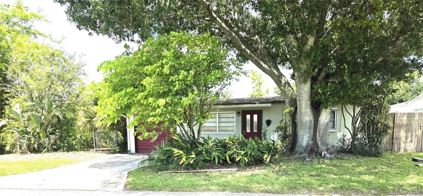 This is a solidly built CBS Waterfront home located in the quaint community of Lucy Island — just minutes from shopping, dining, and the post office. Home has a durable concrete roof, offering lasting quality and peace of mind. Key Features: 127 feet of waterfront with a good seawall, Spacious Florida room with water views, High ceilings and open layout, Hurricane panels for added protection, Newer A/C unit, Washer & dryer located in the garage, Two wooden patio decks for outdoor relaxation, Mature fruit trees: papaya, avocado & banana. Concrete driveway and privacy fence on one side. No neighbor on the opposite side, offering extra privacy. Enjoy a quiet, private backyard with great water views — perfect for relaxing or entertaining. This home offers durability, location, and charm in the quaint neighborhood of Lucy Island! Call today to schedule your walk through!